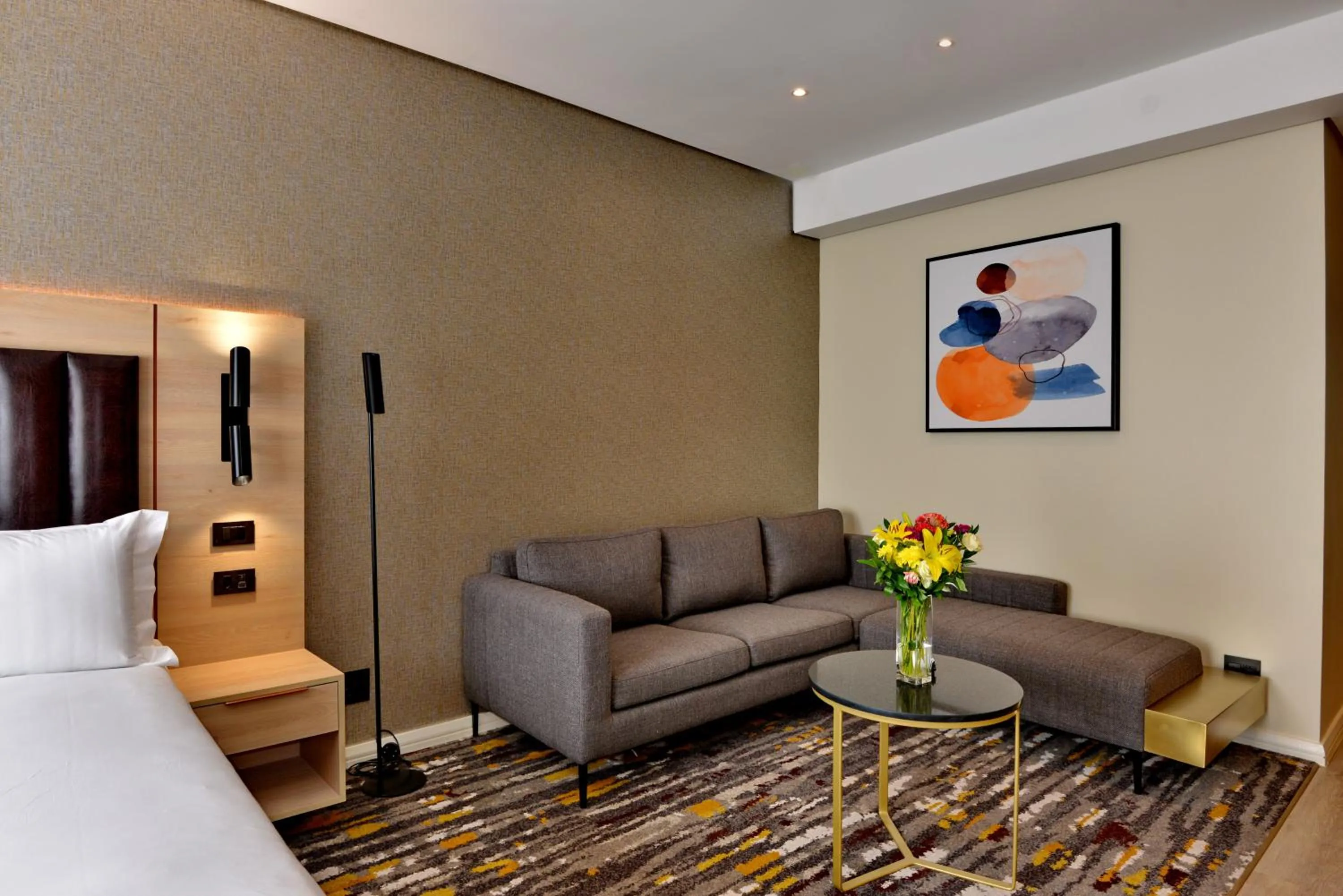 Seating area, Bed in @Sandton Hotel