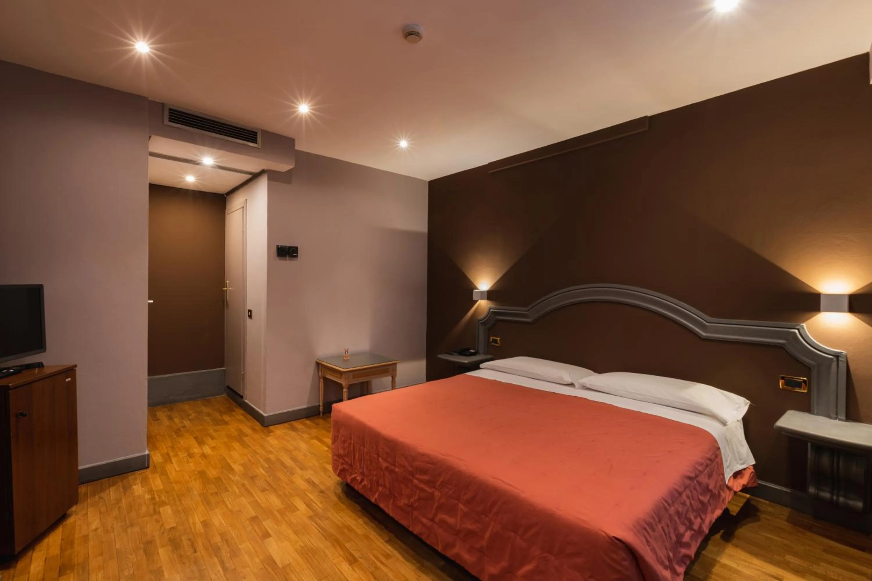 Bed in Hotel Unicorno