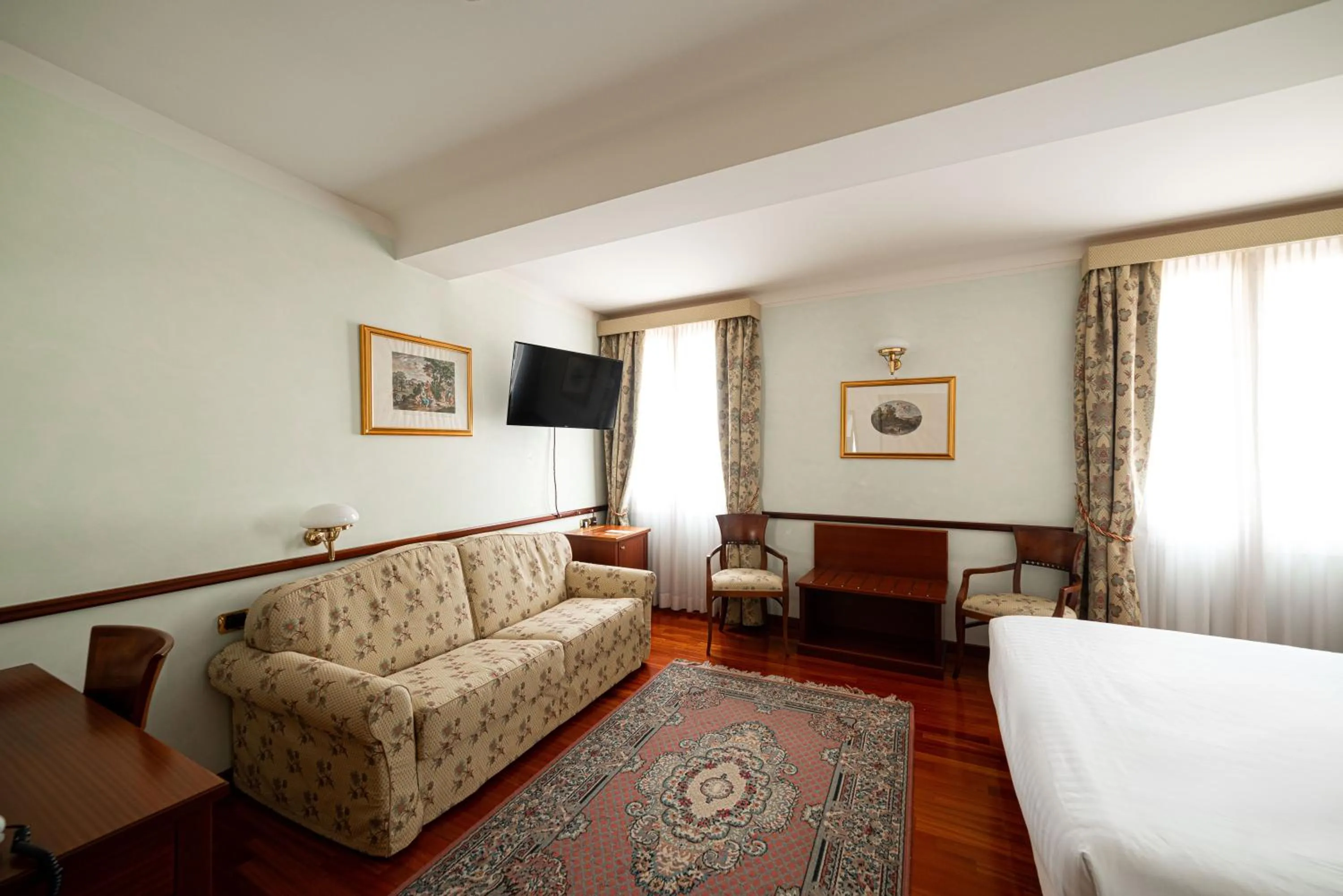 Seating area, Bed in Phi Hotel Dei Medaglioni