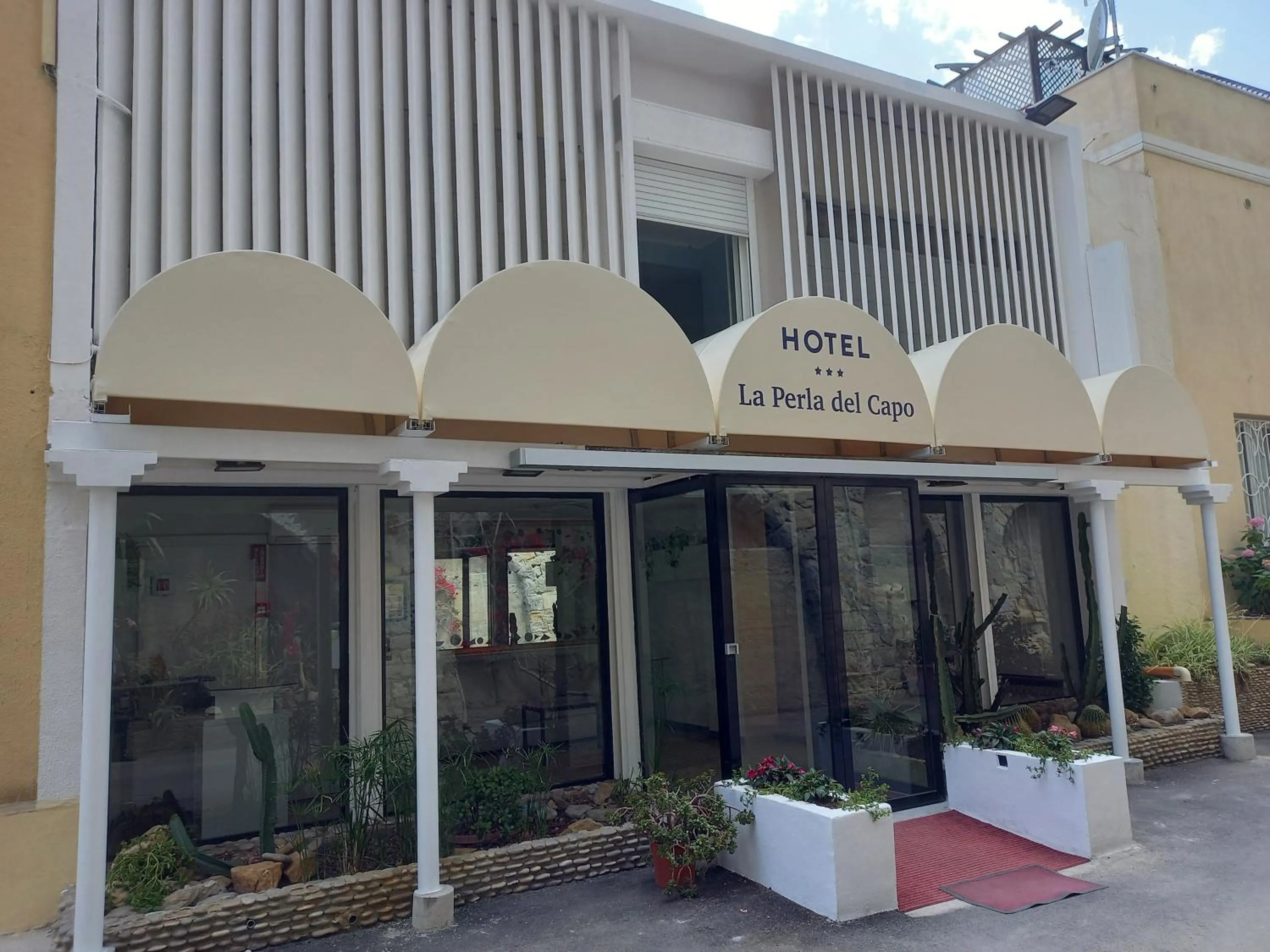 Property building in Hotel La Perla Del Capo