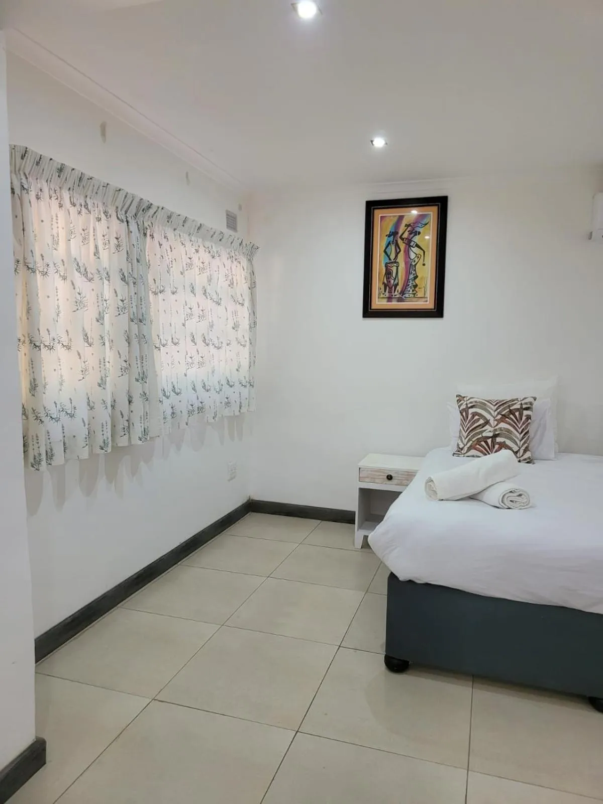 Bed in Heroes Garden Lodge