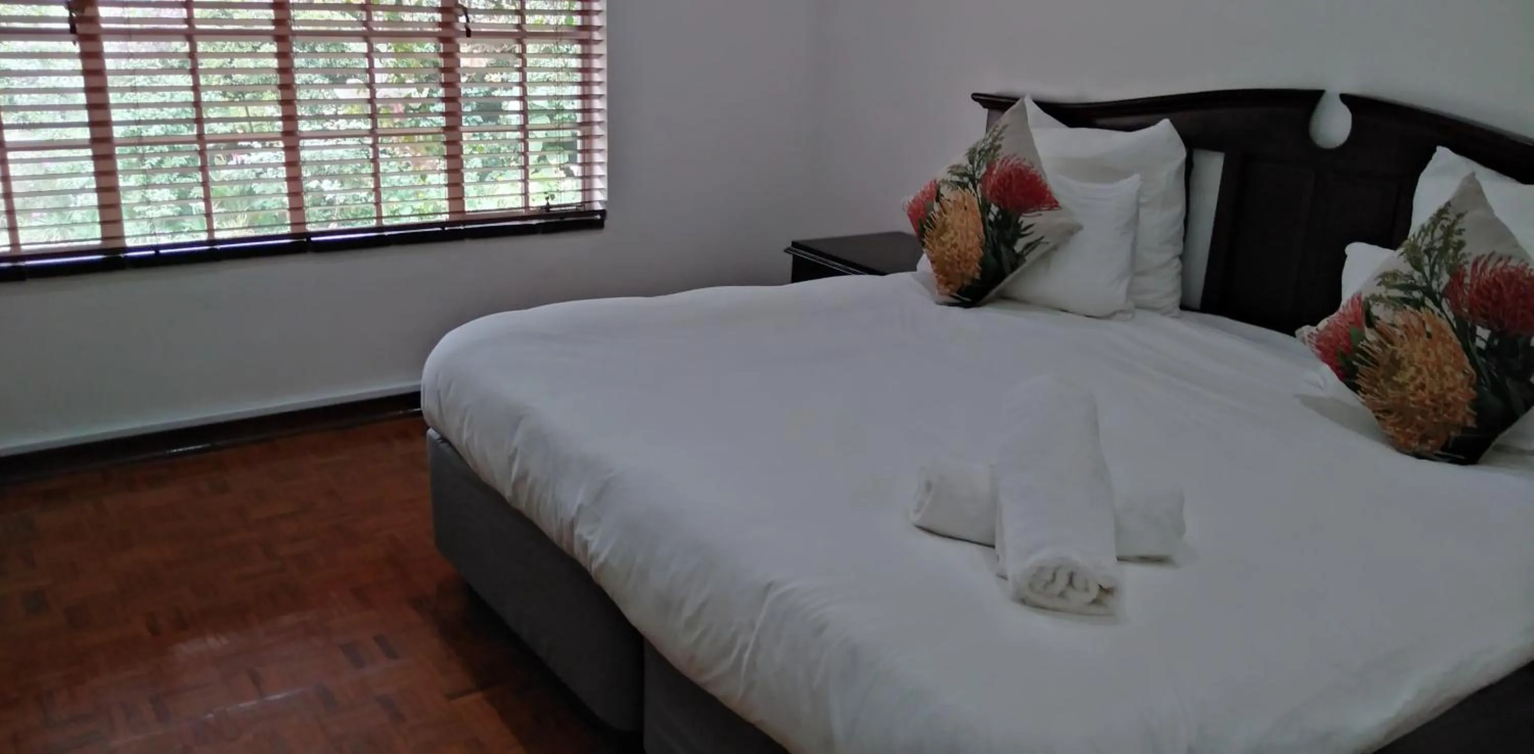 Bed in Heroes Garden Lodge