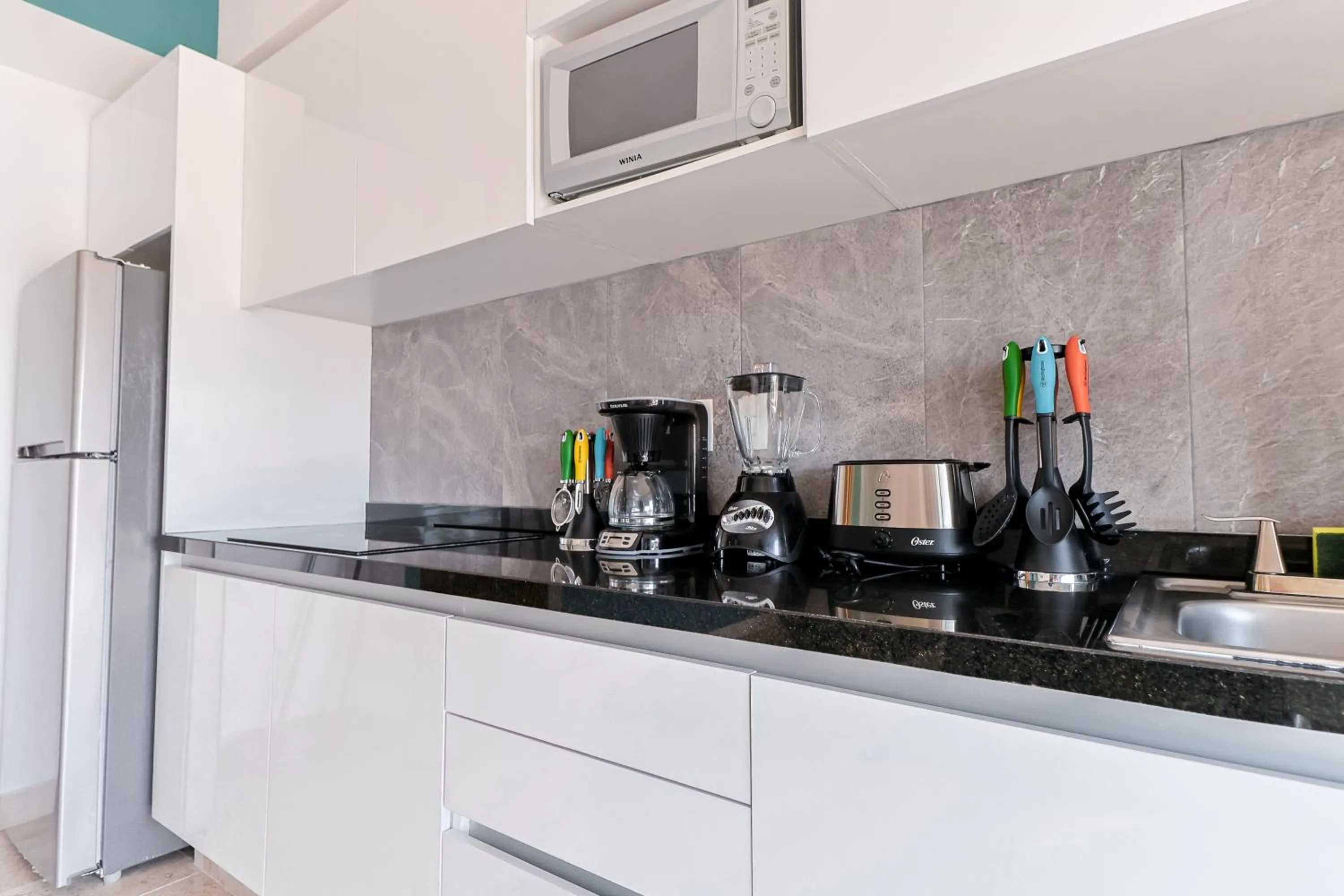 kitchen in Torre Diez by Grupo Amber