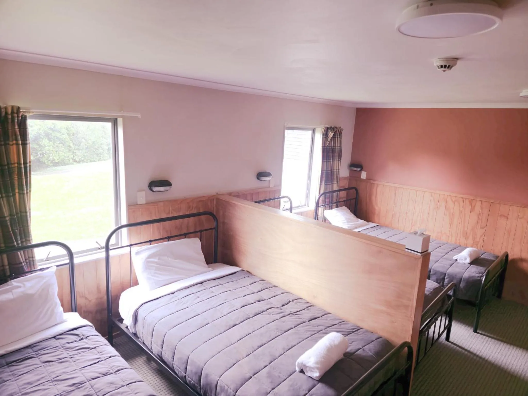 Bed in Waitomo Village Chalets home of Kiwipaka