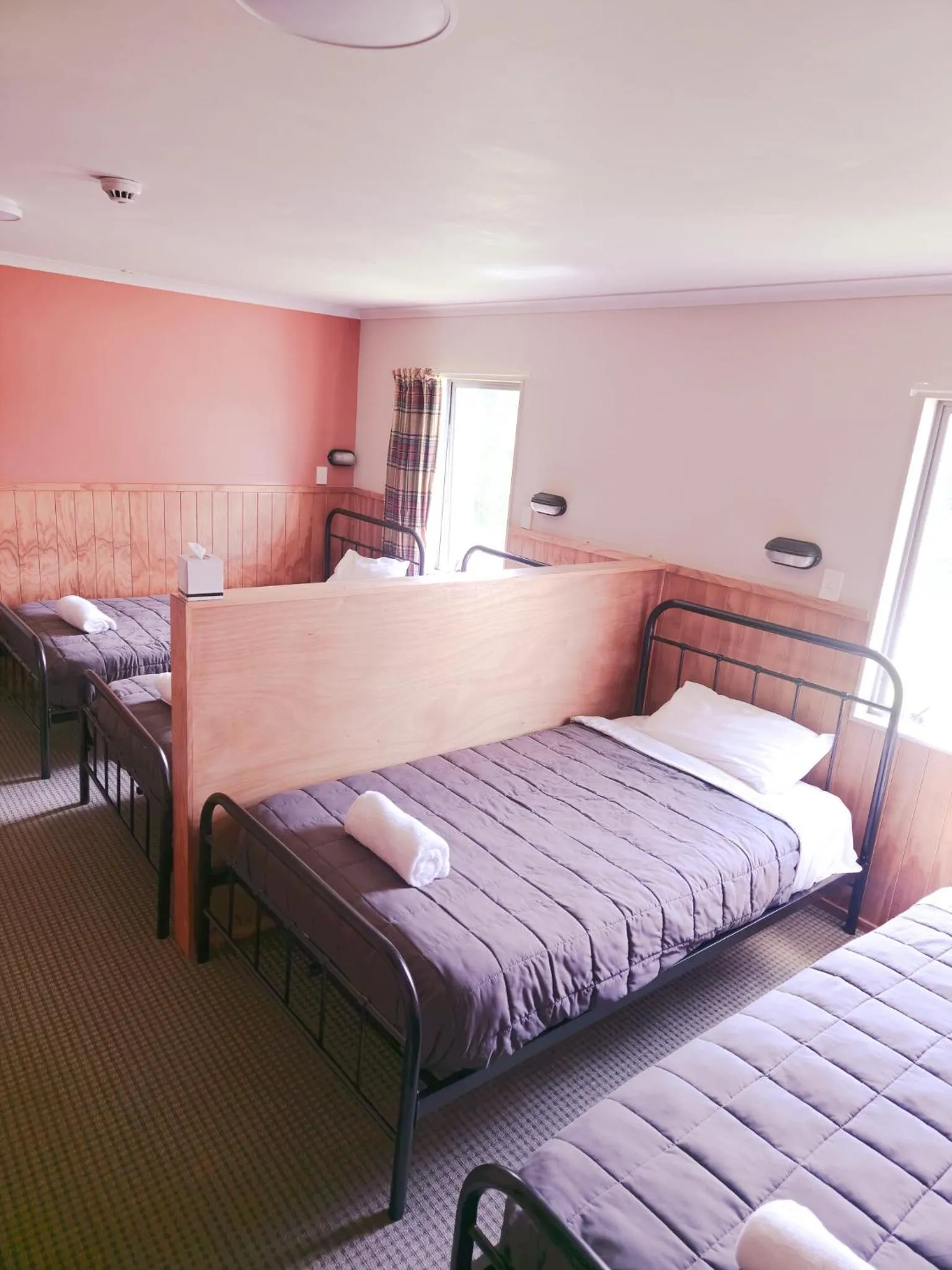 Bed in Waitomo Village Chalets home of Kiwipaka