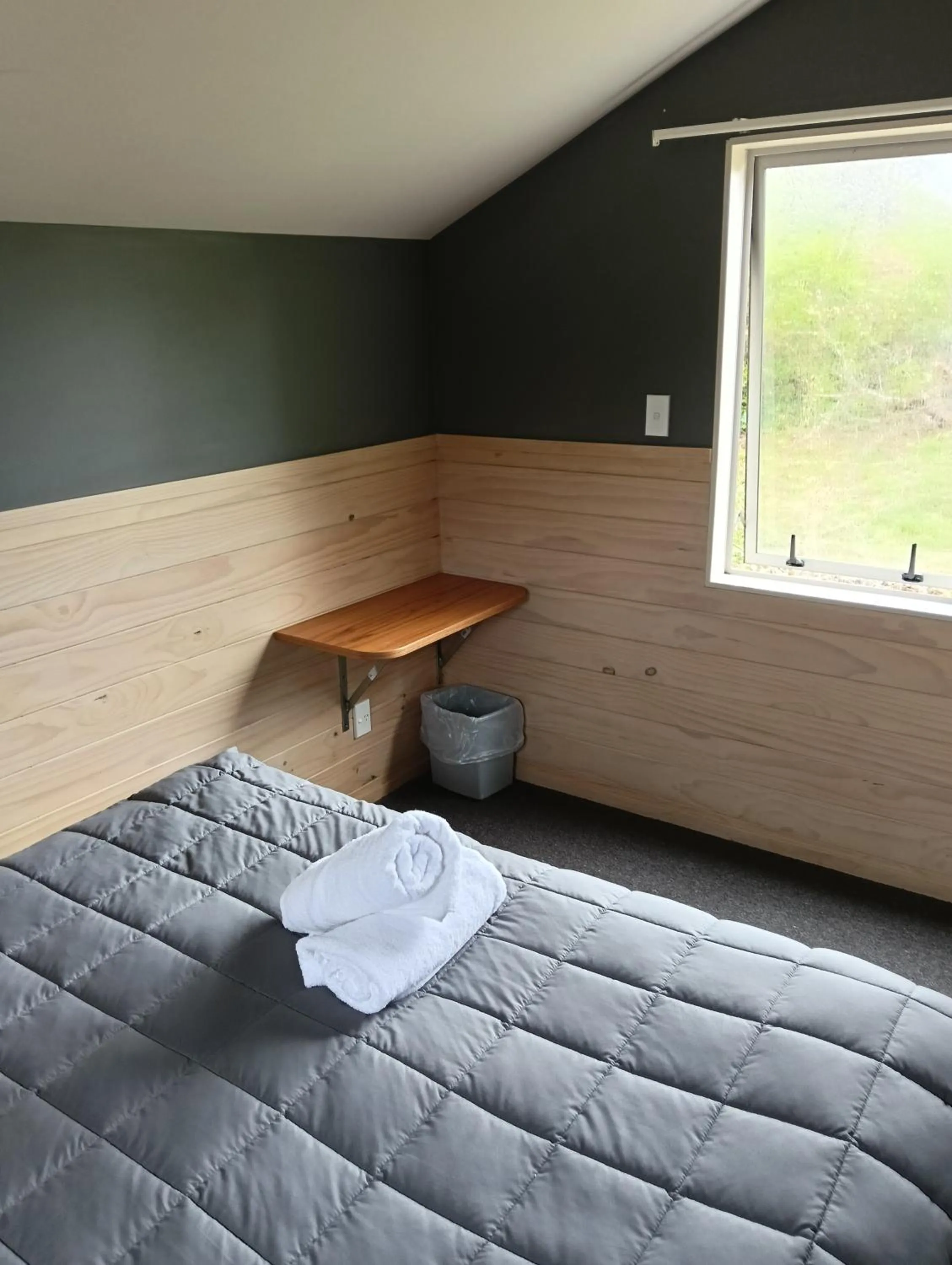 Bed in Waitomo Village Chalets home of Kiwipaka