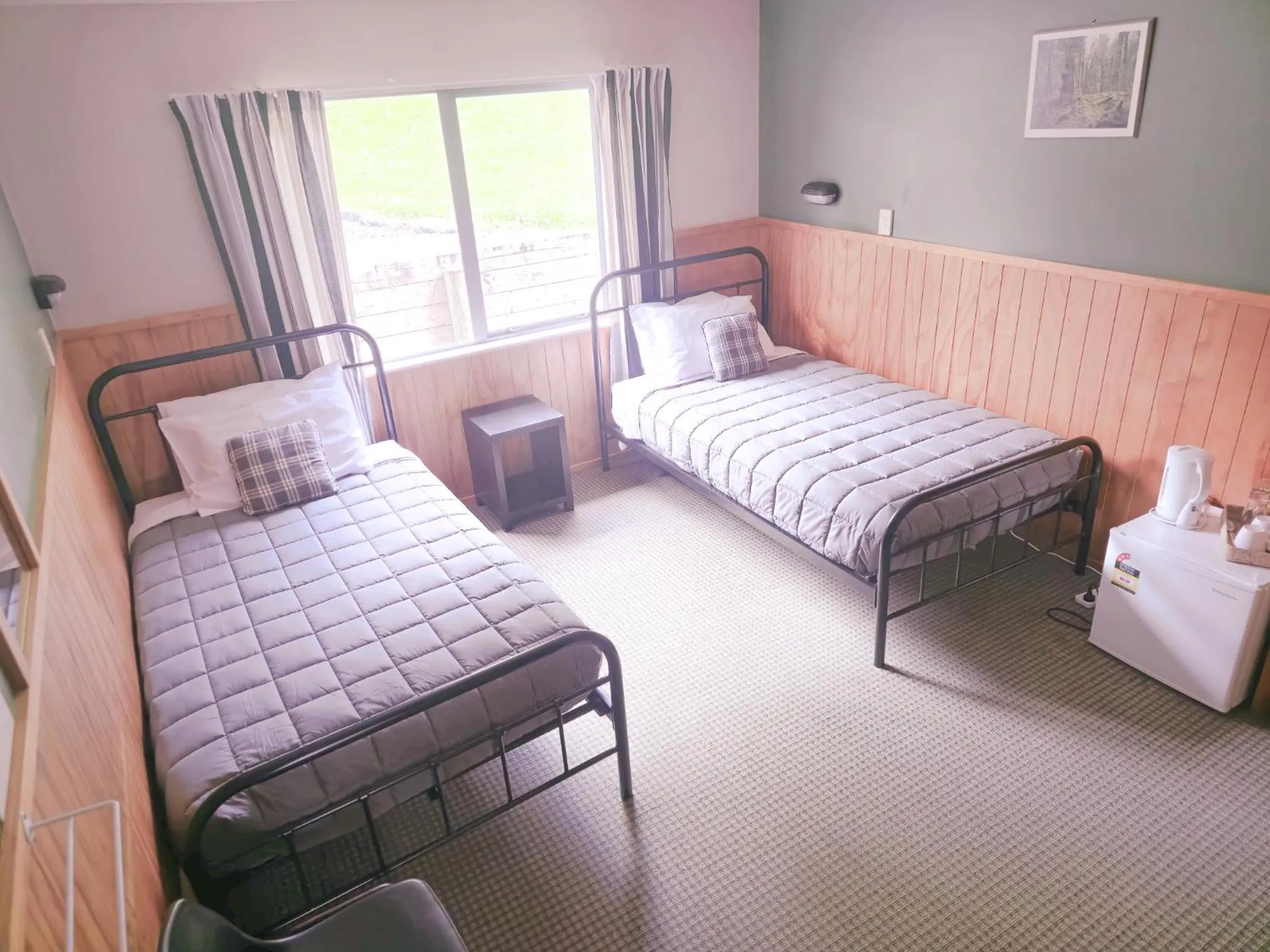 Bedroom, Bed in Waitomo Village Chalets home of Kiwipaka