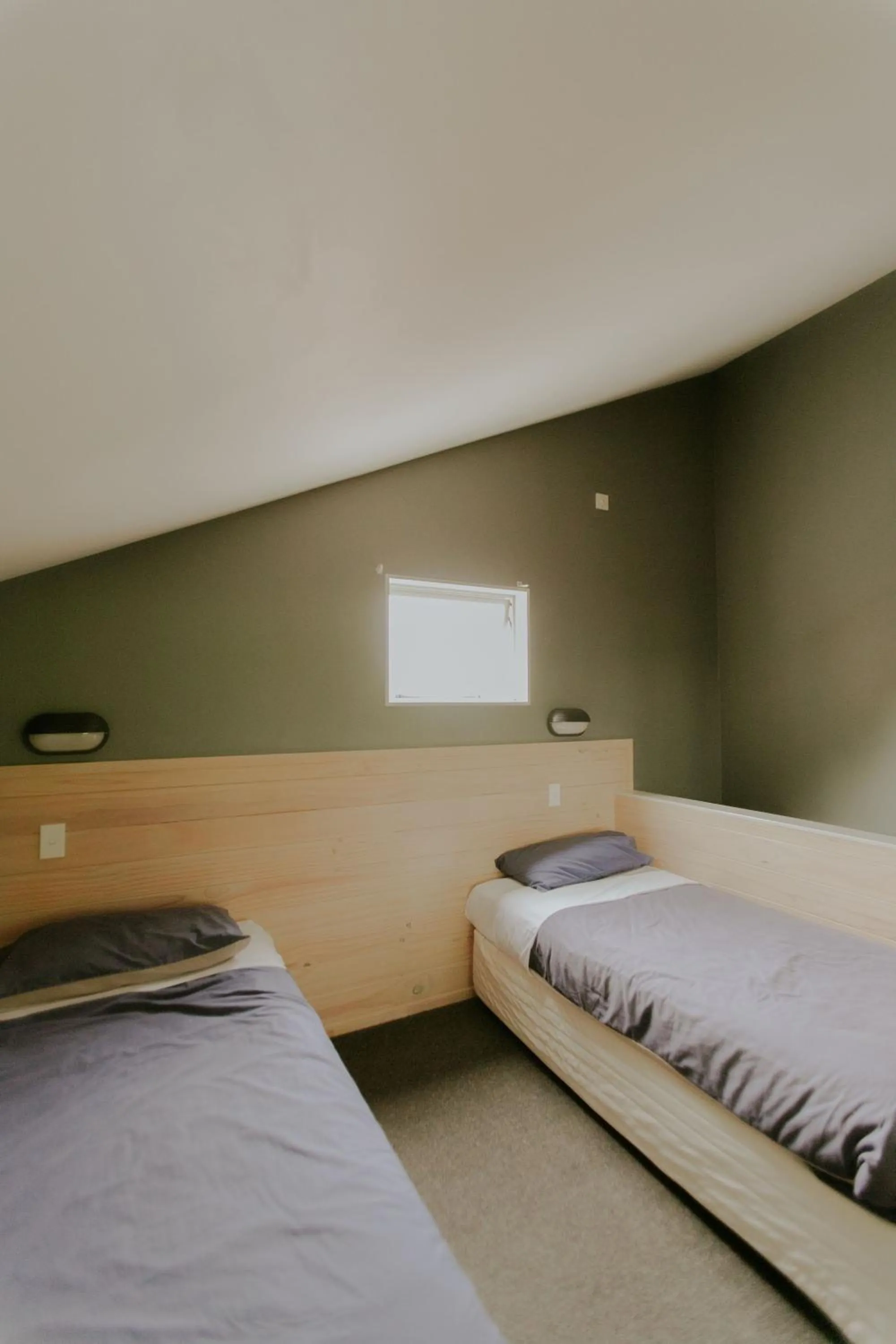 Bedroom, Bed in Waitomo Village Chalets home of Kiwipaka