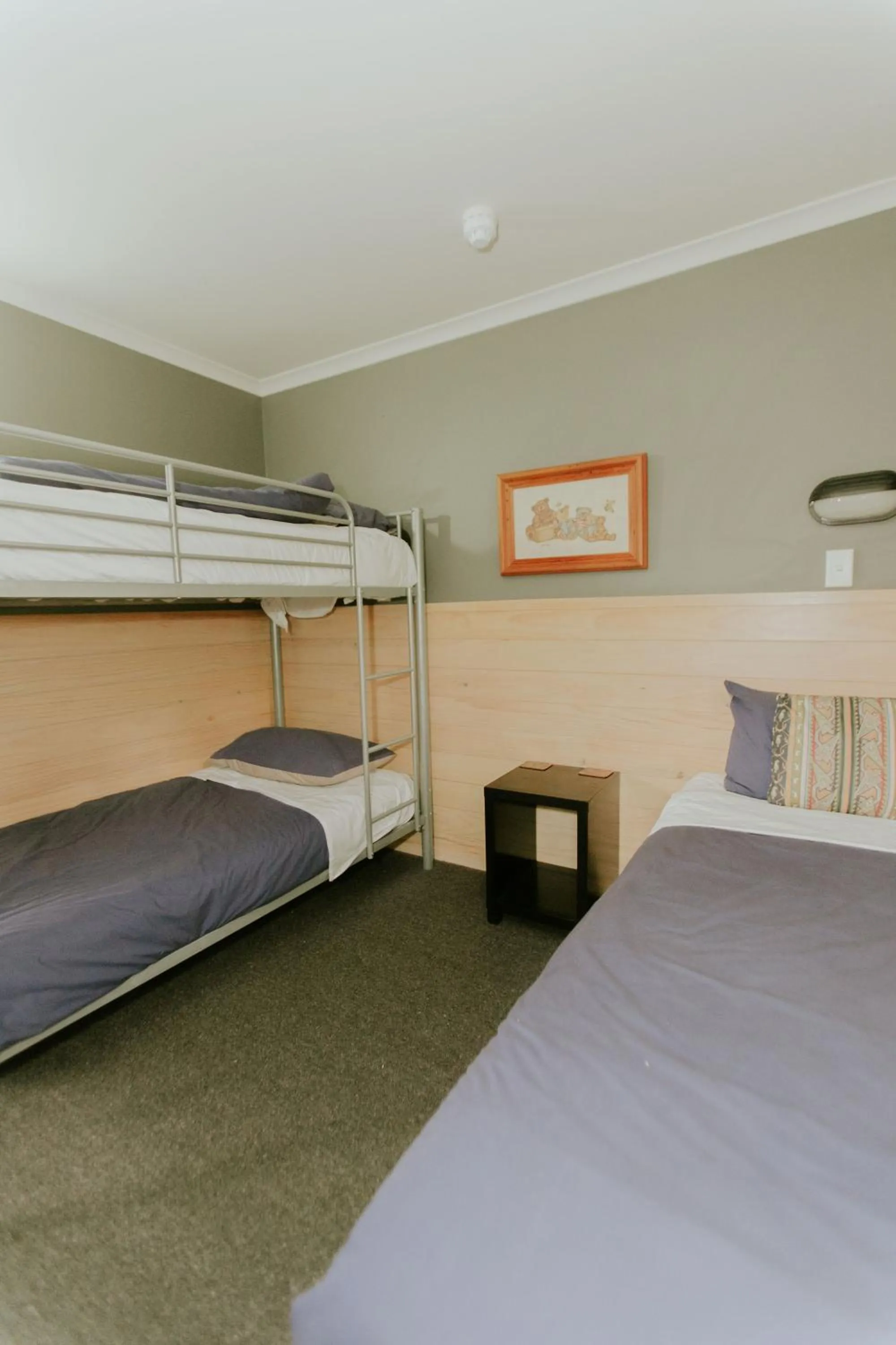 Bed in Waitomo Village Chalets home of Kiwipaka