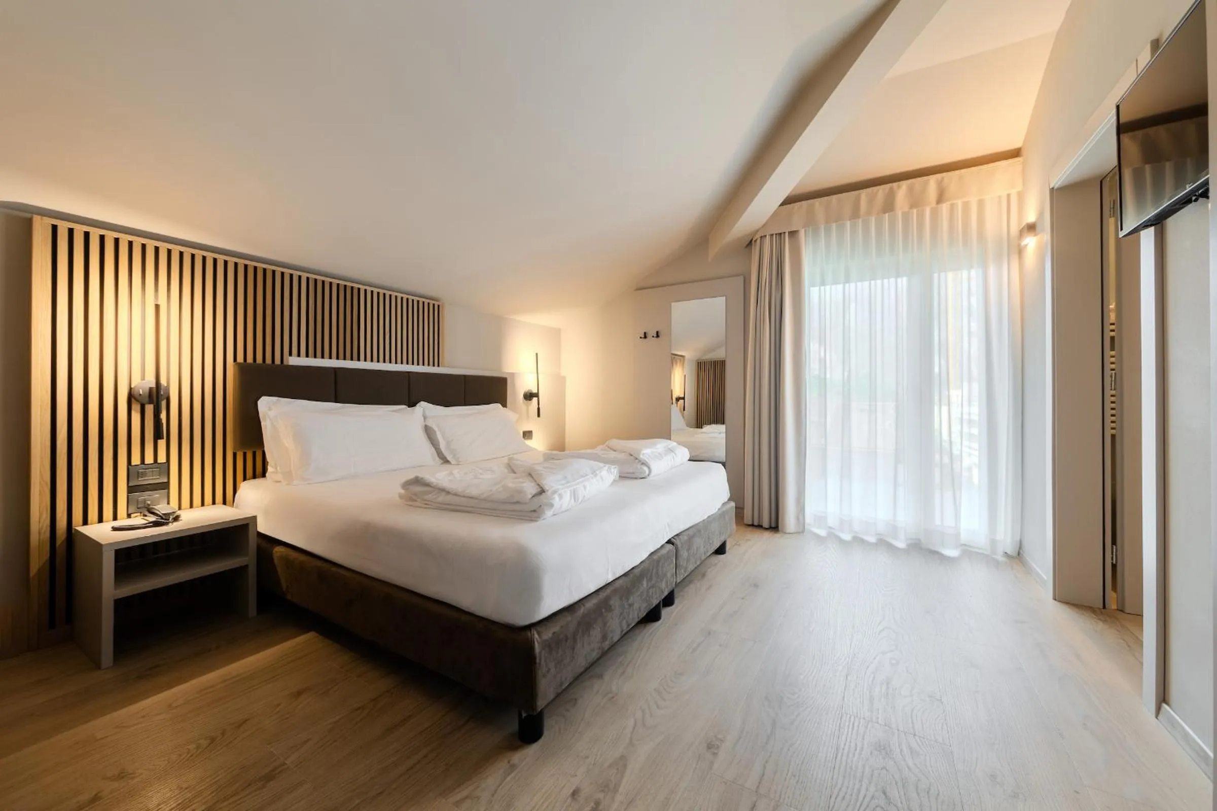 Photo of the whole room, Bed in Brione Green Resort