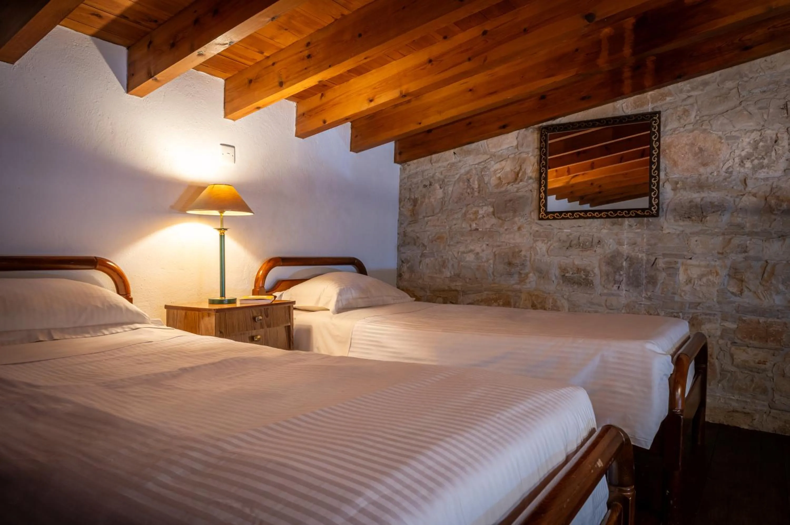 Bed in Oinoessa Traditional Boutique Guest Houses