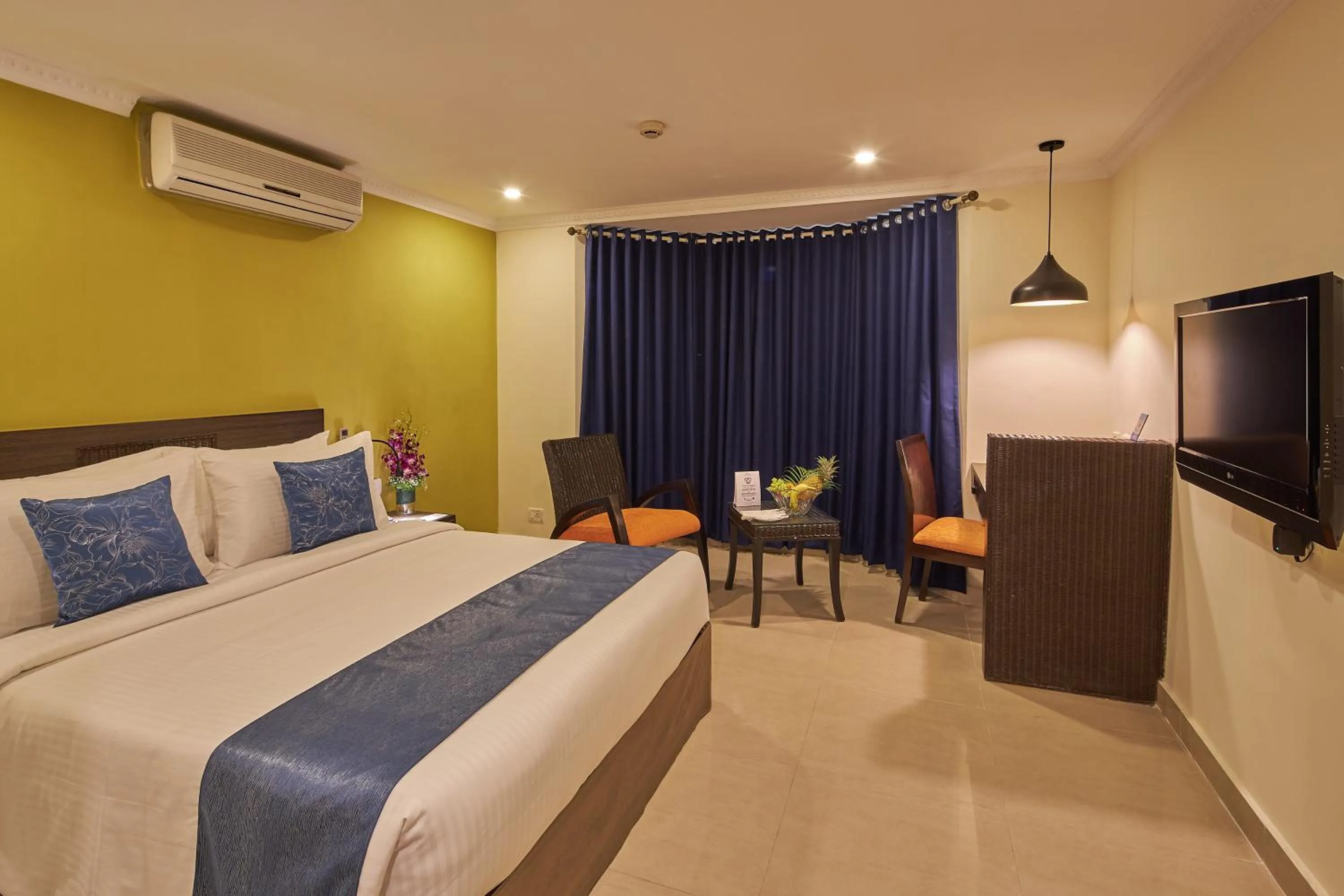 Photo of the whole room, Bed in Tulip Inn Koramangala Bangalore