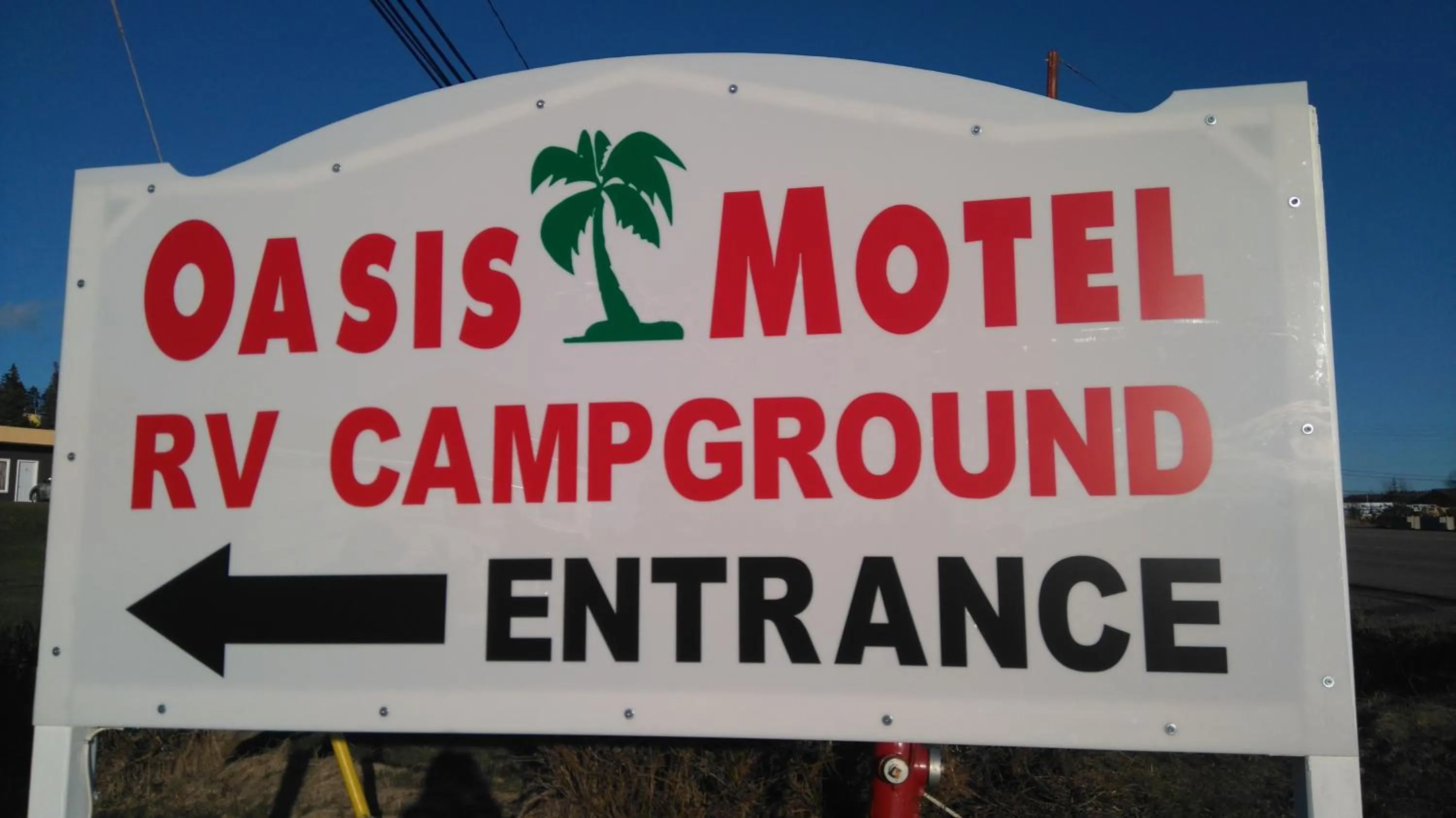 Property logo or sign in Oasis Motel