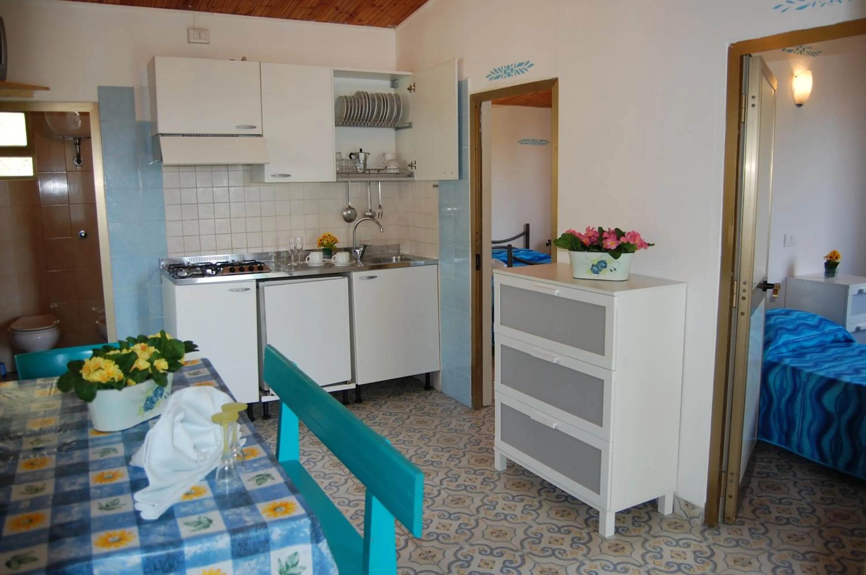 Kitchen or kitchenette, Bed in Villaggio Residence Nettuno
