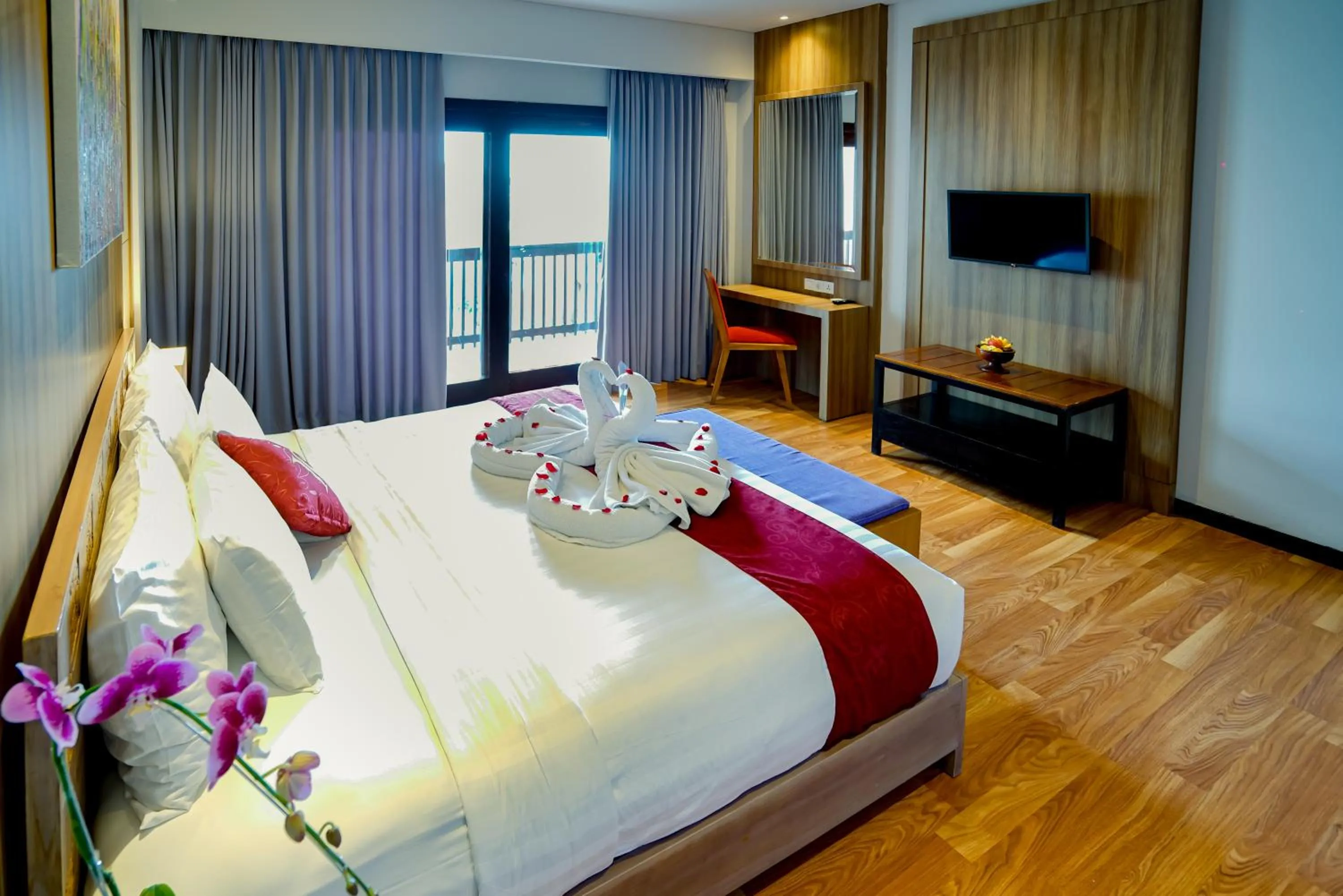 Communal lounge/ TV room, Bed in The Kirana Canggu Hotel