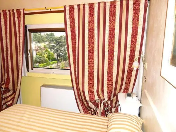 Bed in Ai Ronchi Motor Hotel Brescia