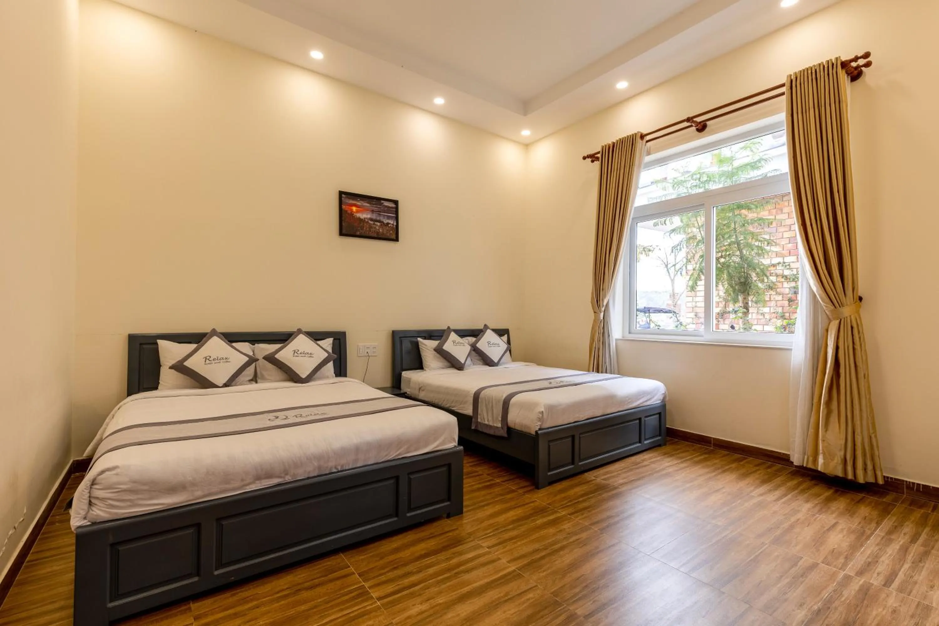 Bedroom in Relax Hotel by Ixorat