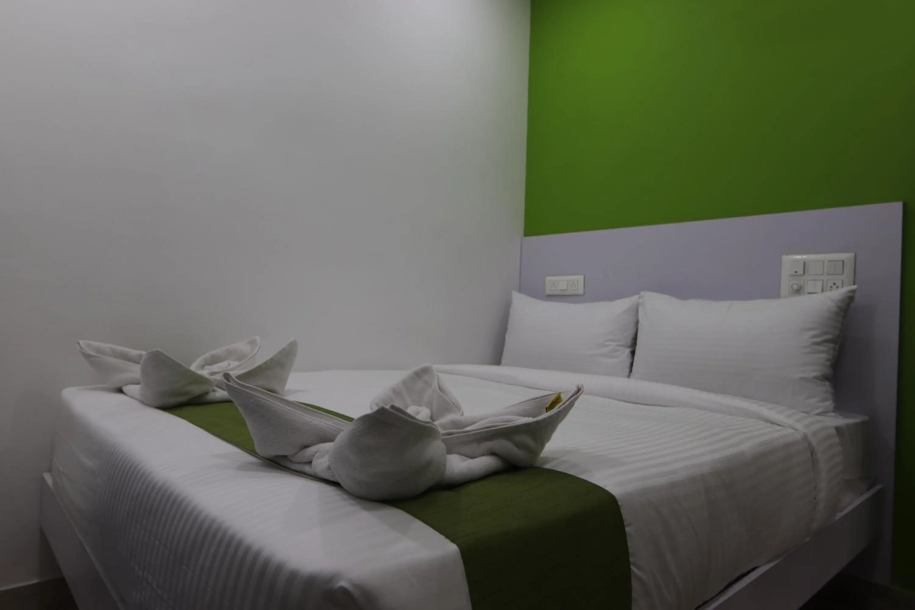 Bed in Athulya Stays