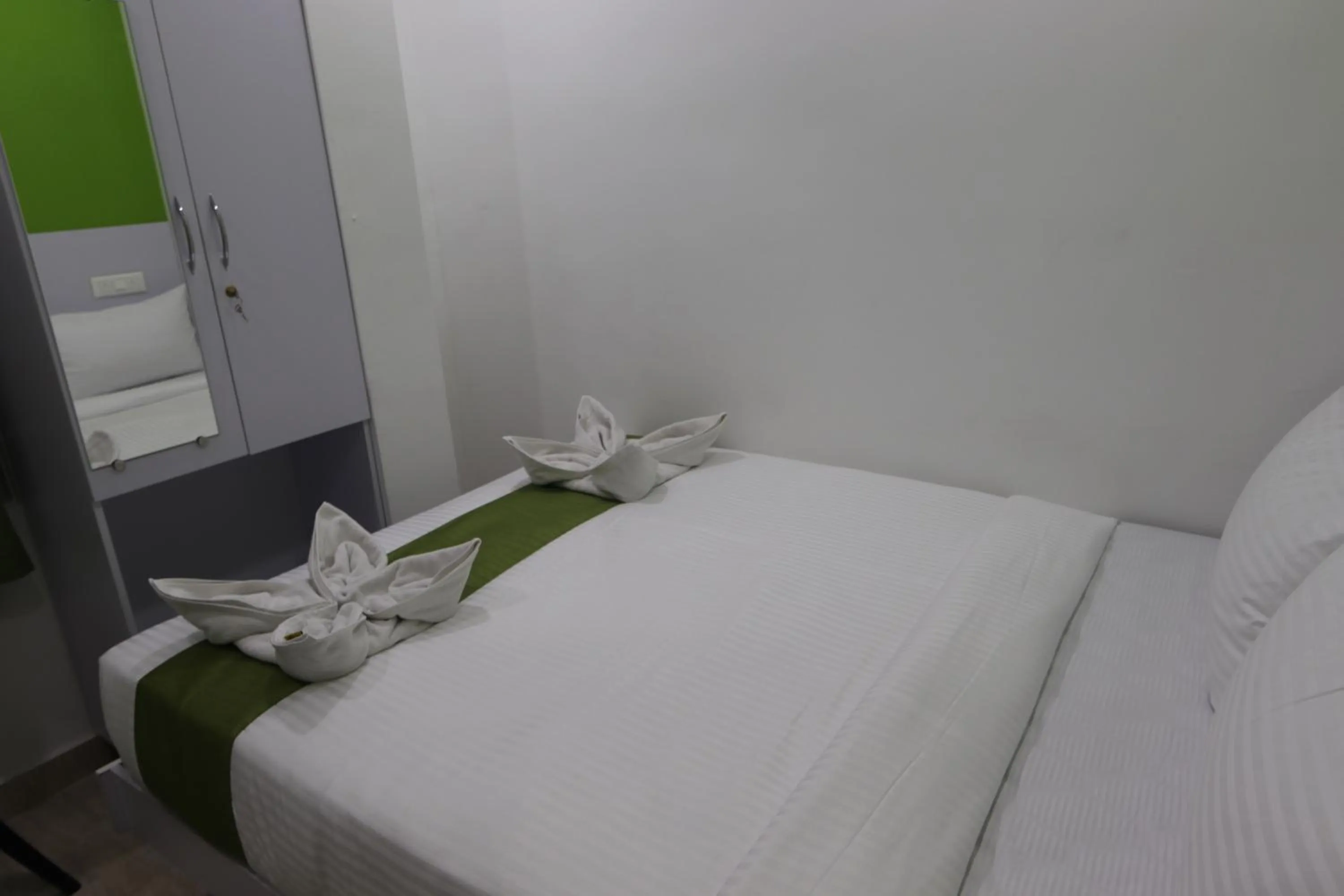 Bed in Athulya Stays