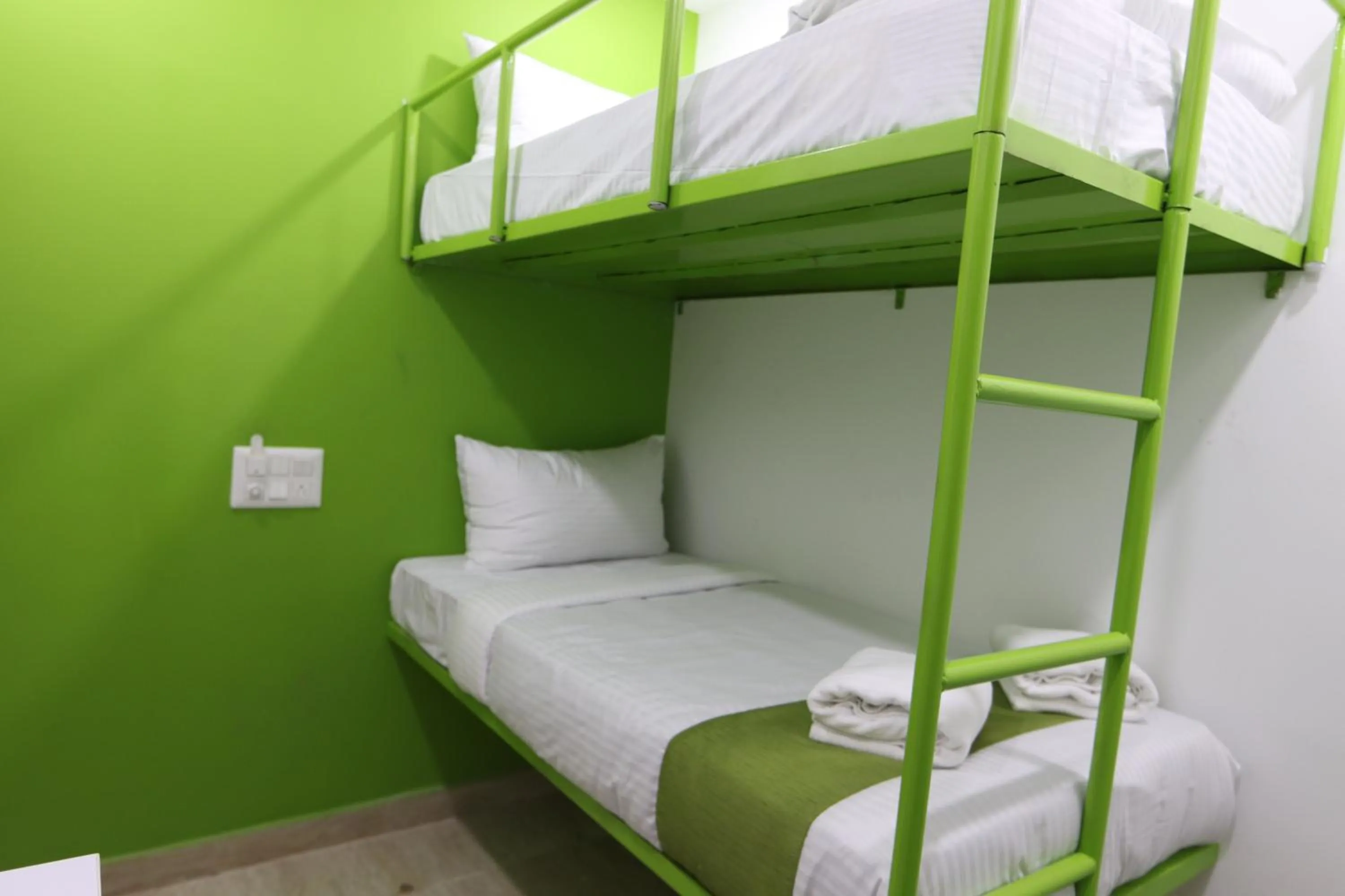 Bed in Athulya Stays