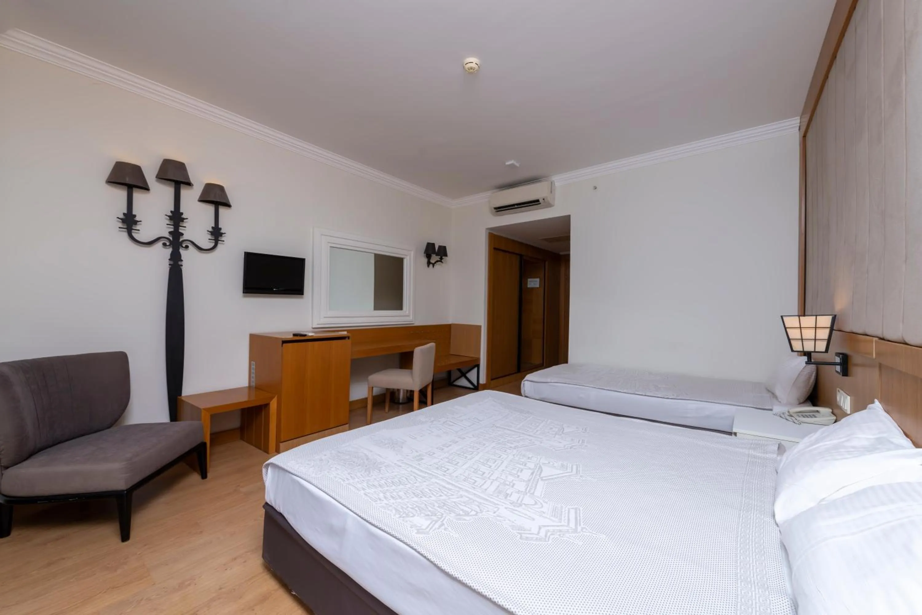 Seating area, Bed in LRS Hotels Lake River Side Hotel & Spa - Ultra All Inclusive