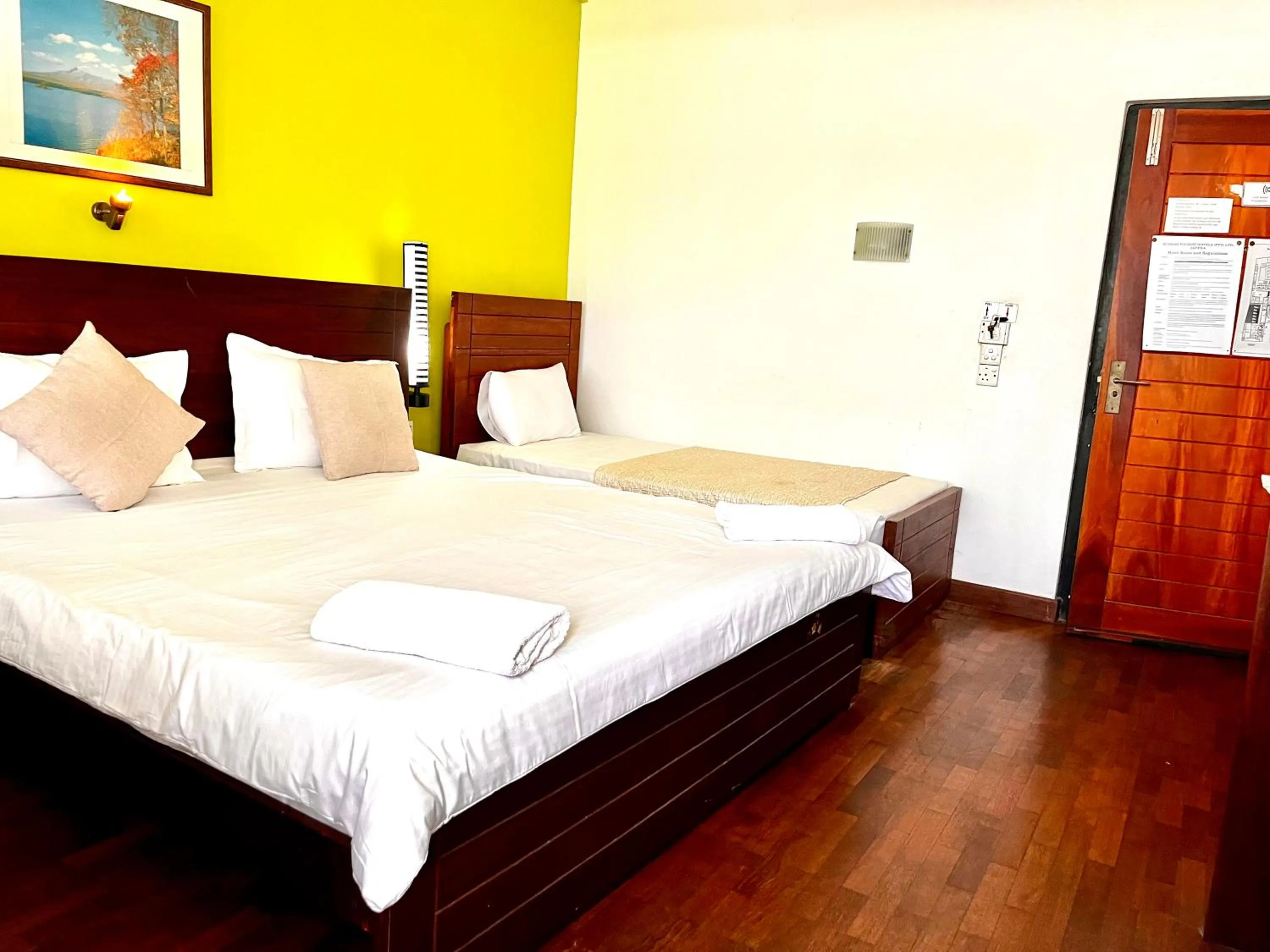 Photo of the whole room, Bed in Subhas Tourist Hotel
