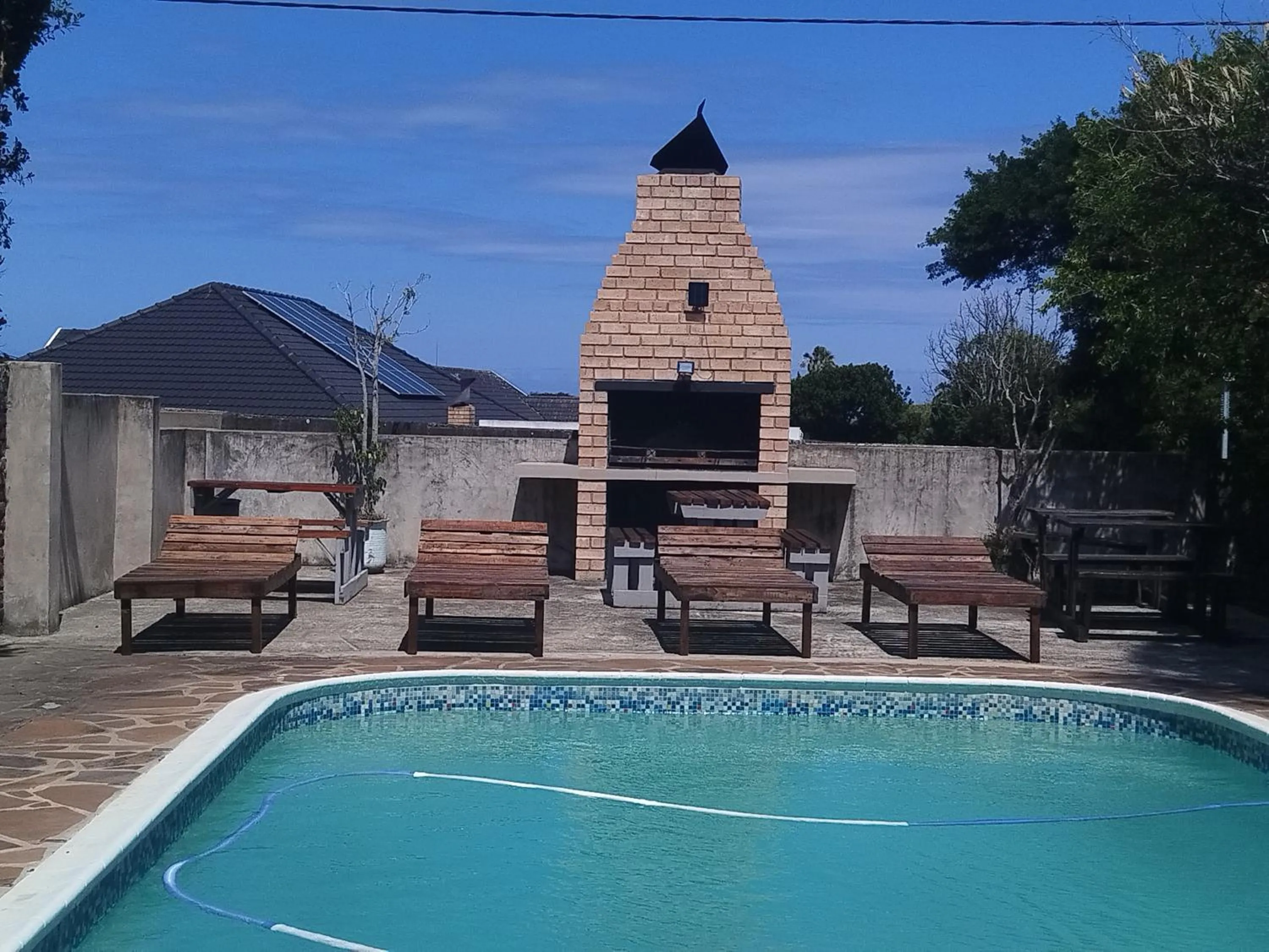 Swimming pool in Palm Tree BnB
