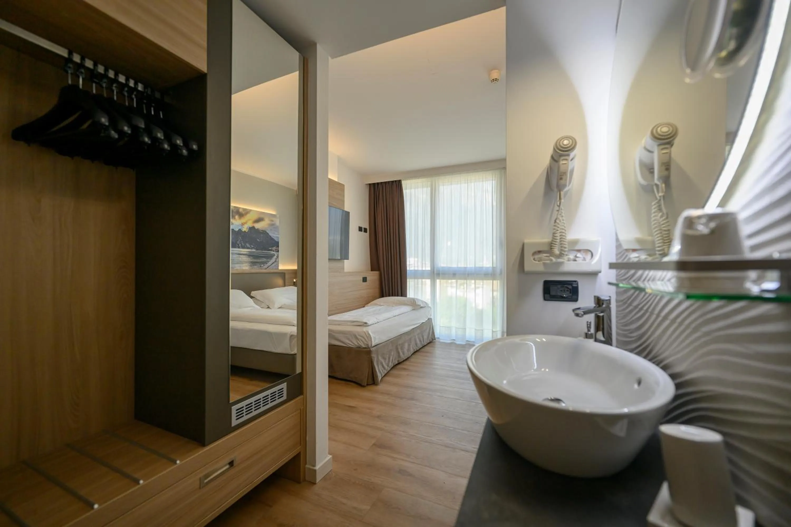 Bed in Ambassador Suite Hotel