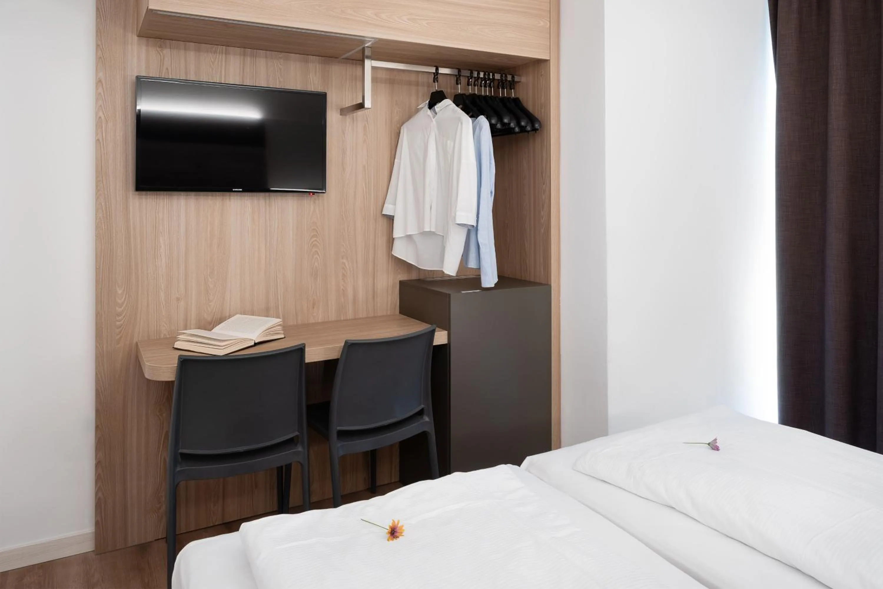 Bed in Ambassador Suite Hotel