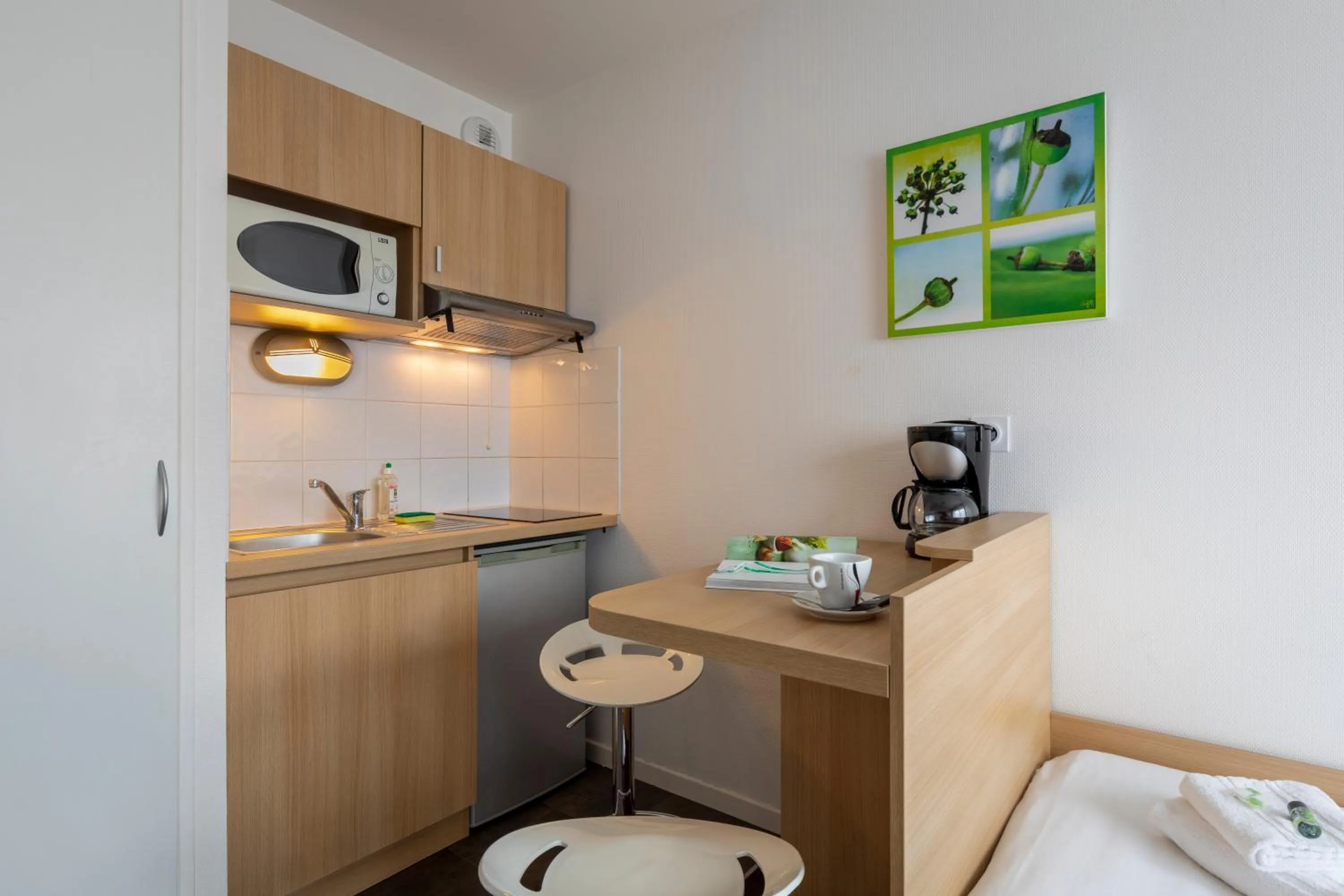 Kitchen or kitchenette in Kosy Appart'hotels Troyes City & Park