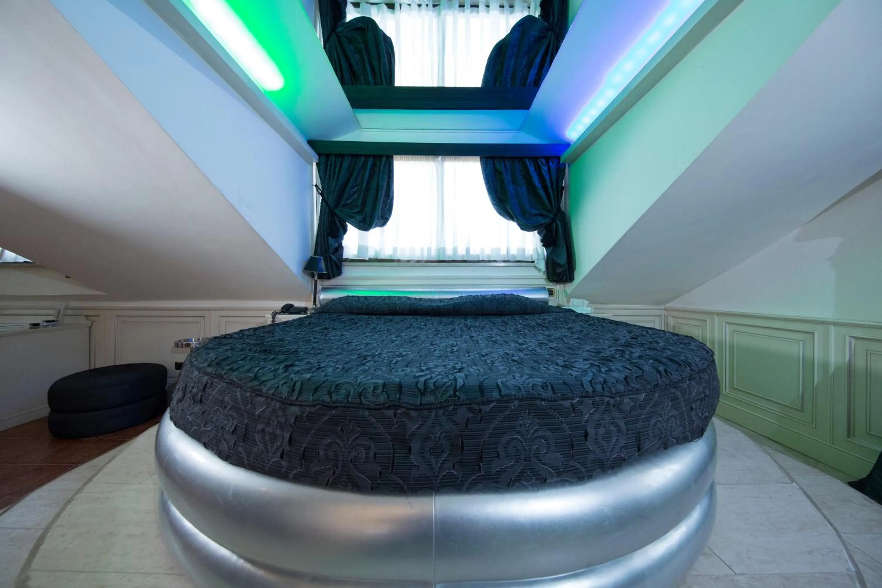 Bed in Mancini Park Hotel