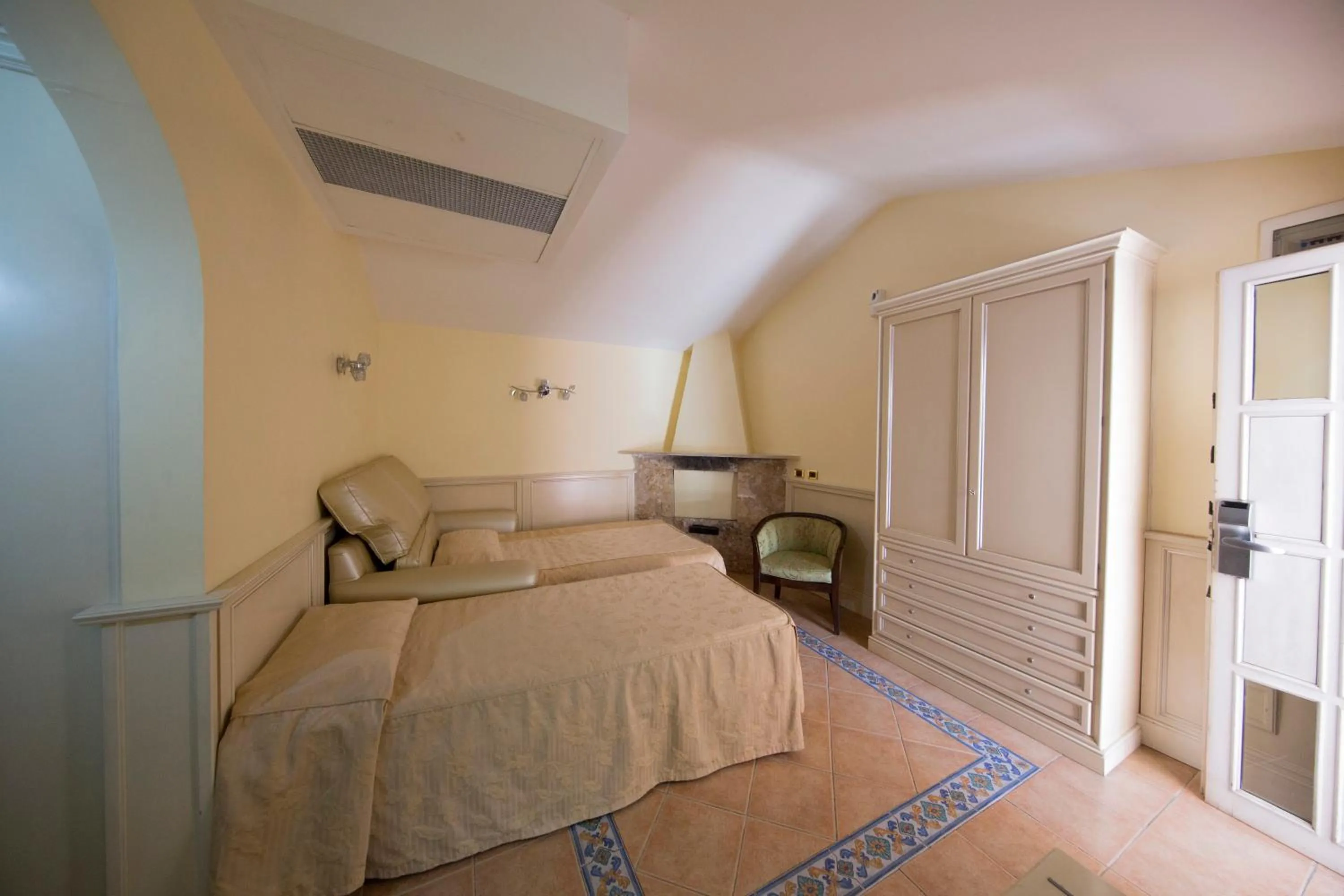 Bed in Mancini Park Hotel