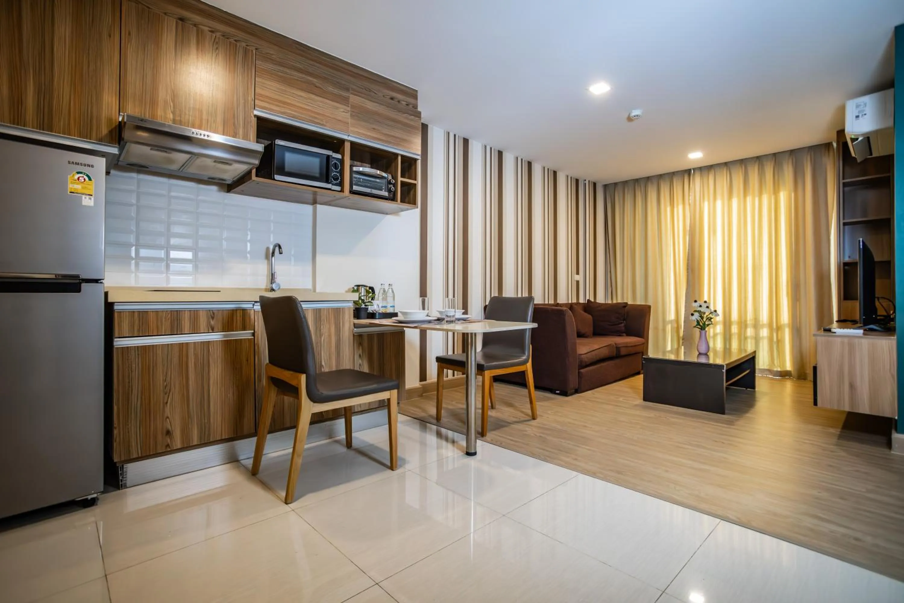 Kitchen or kitchenette in Ramada by Wyndham Bangkok Ten Ekamai Residences