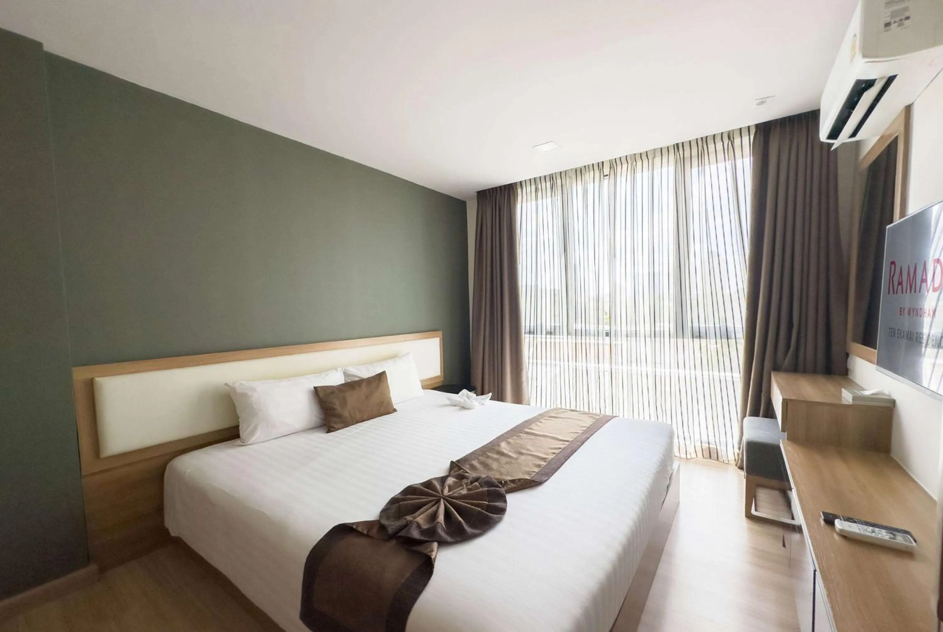 Photo of the whole room, Bed in Ramada by Wyndham Bangkok Ten Ekamai Residences