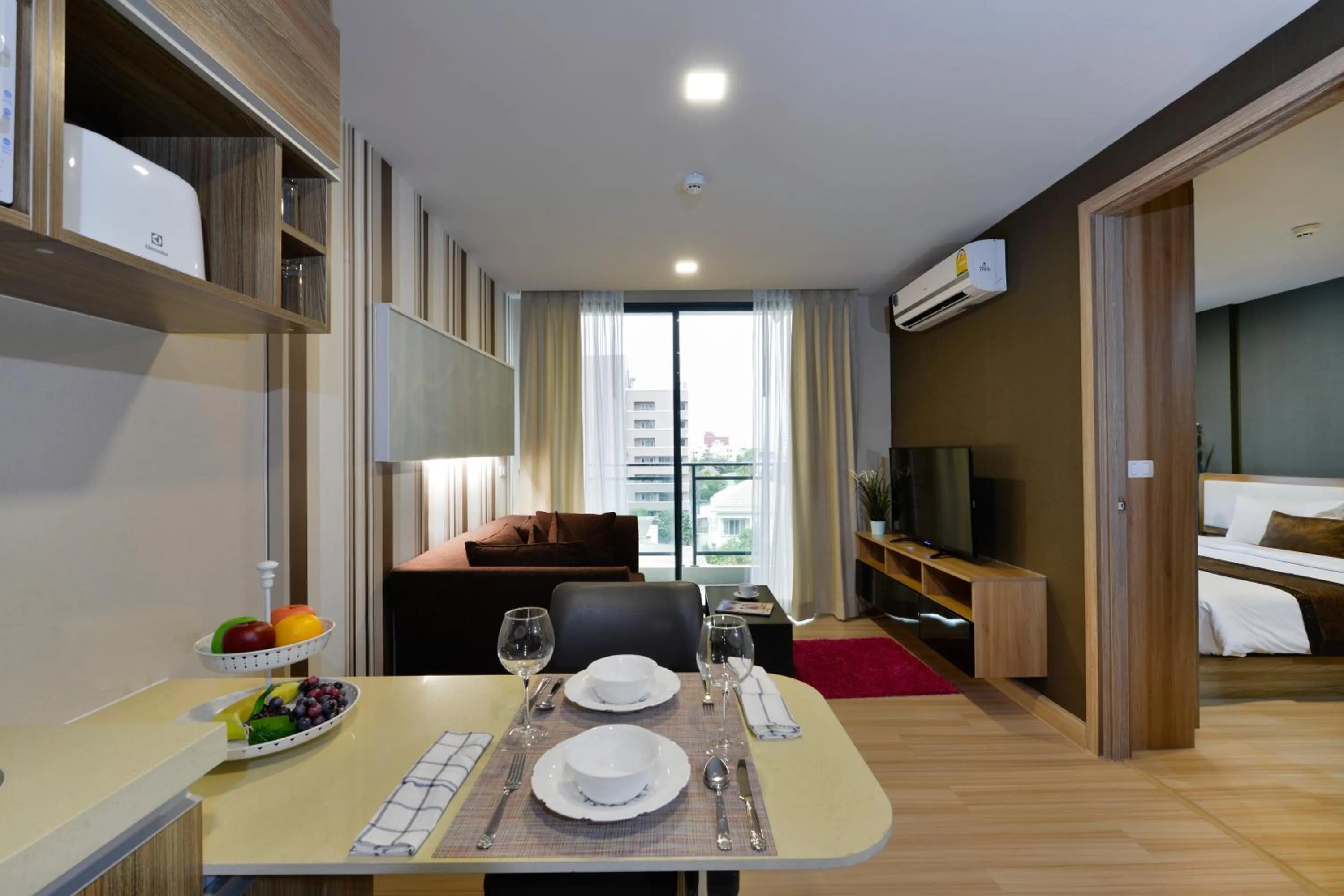 Living room, Bed in Ramada by Wyndham Bangkok Ten Ekamai Residences