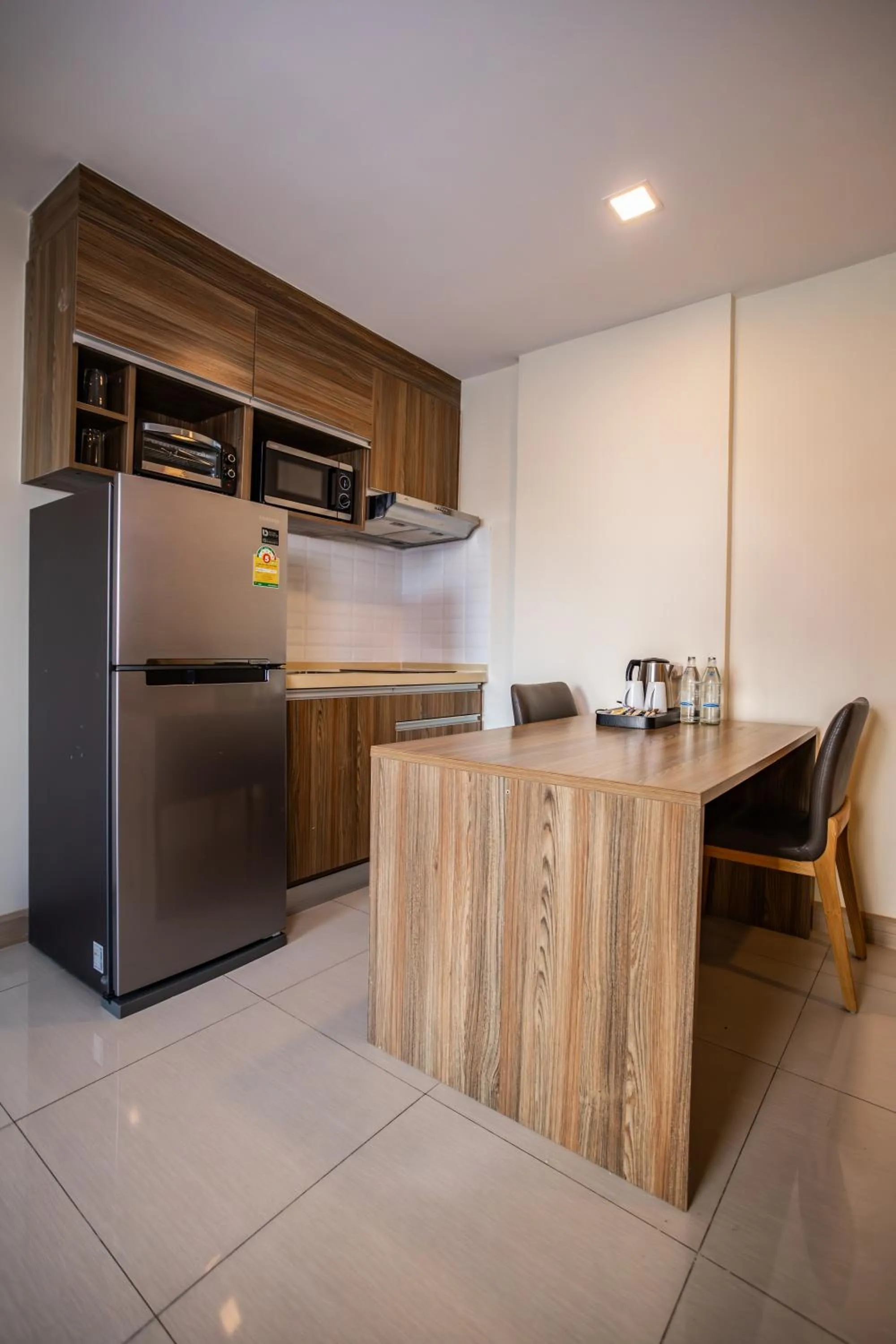 Kitchen or kitchenette in Ramada by Wyndham Bangkok Ten Ekamai Residences