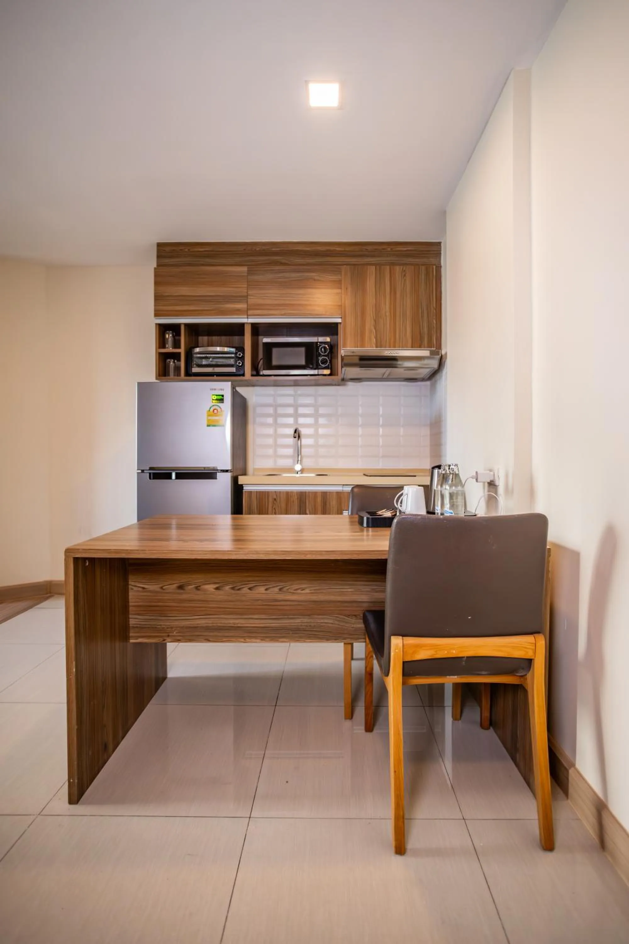Kitchen or kitchenette in Ramada by Wyndham Bangkok Ten Ekamai Residences