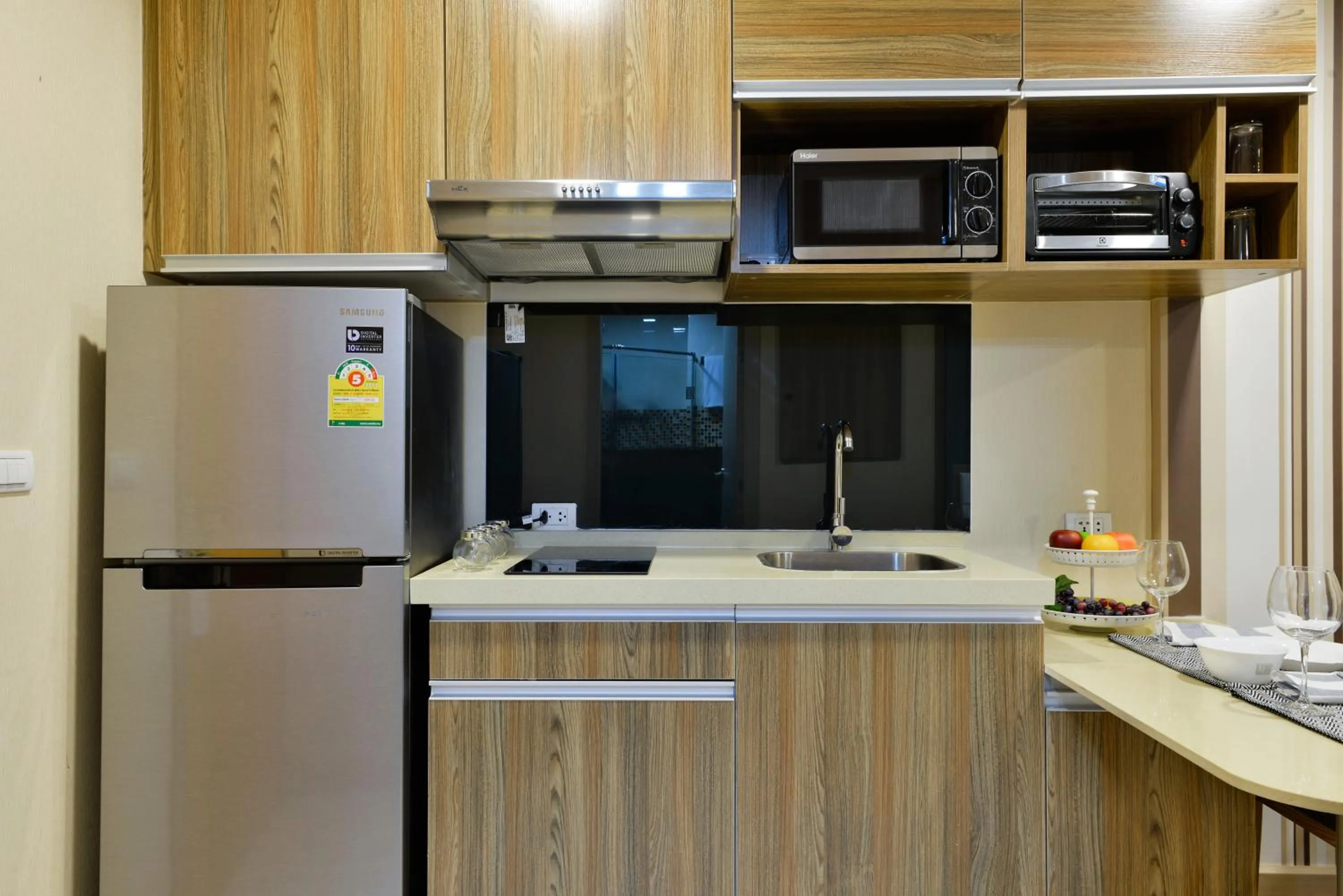 Kitchen or kitchenette in Ramada by Wyndham Bangkok Ten Ekamai Residences