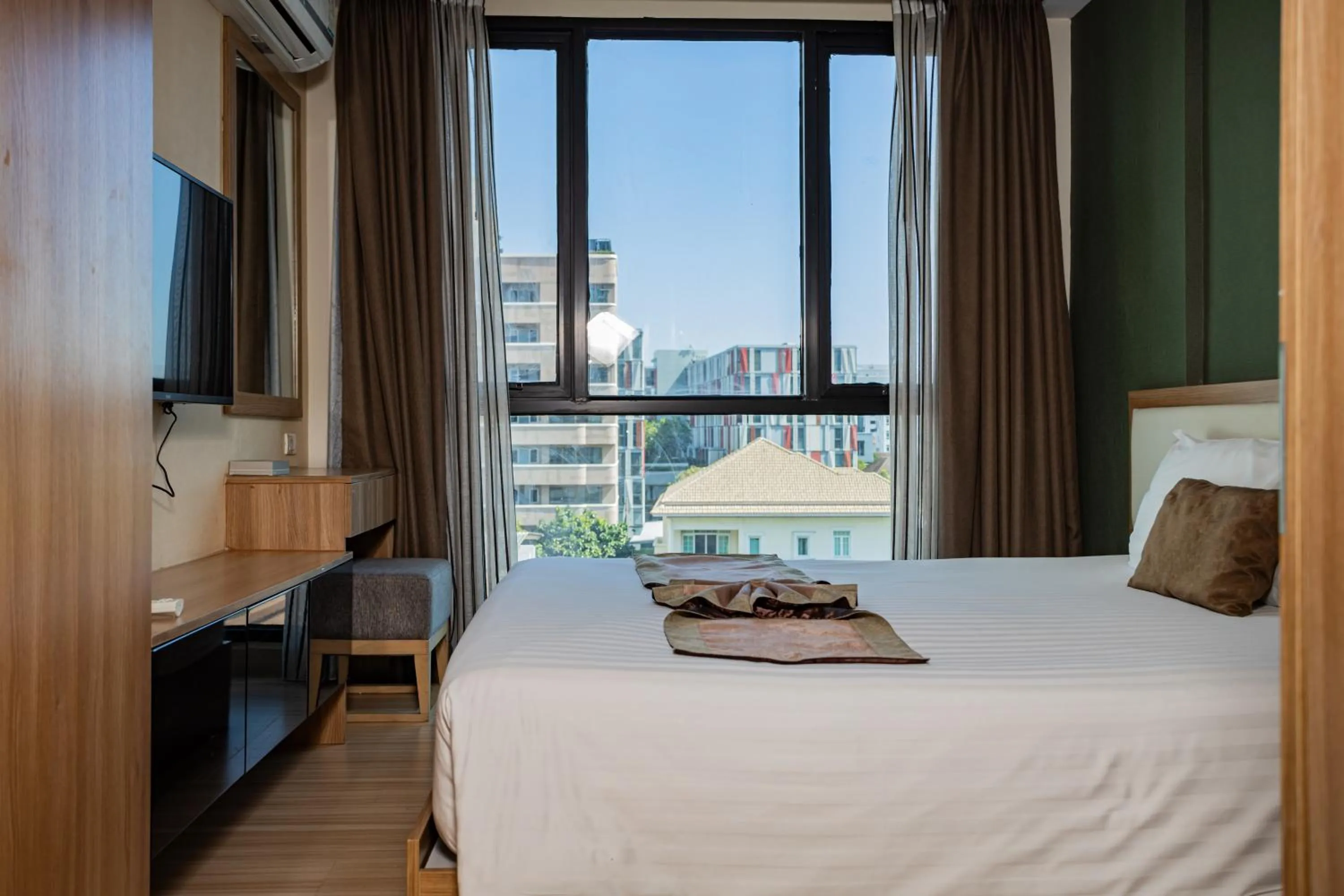 Bed in Ramada by Wyndham Bangkok Ten Ekamai Residences