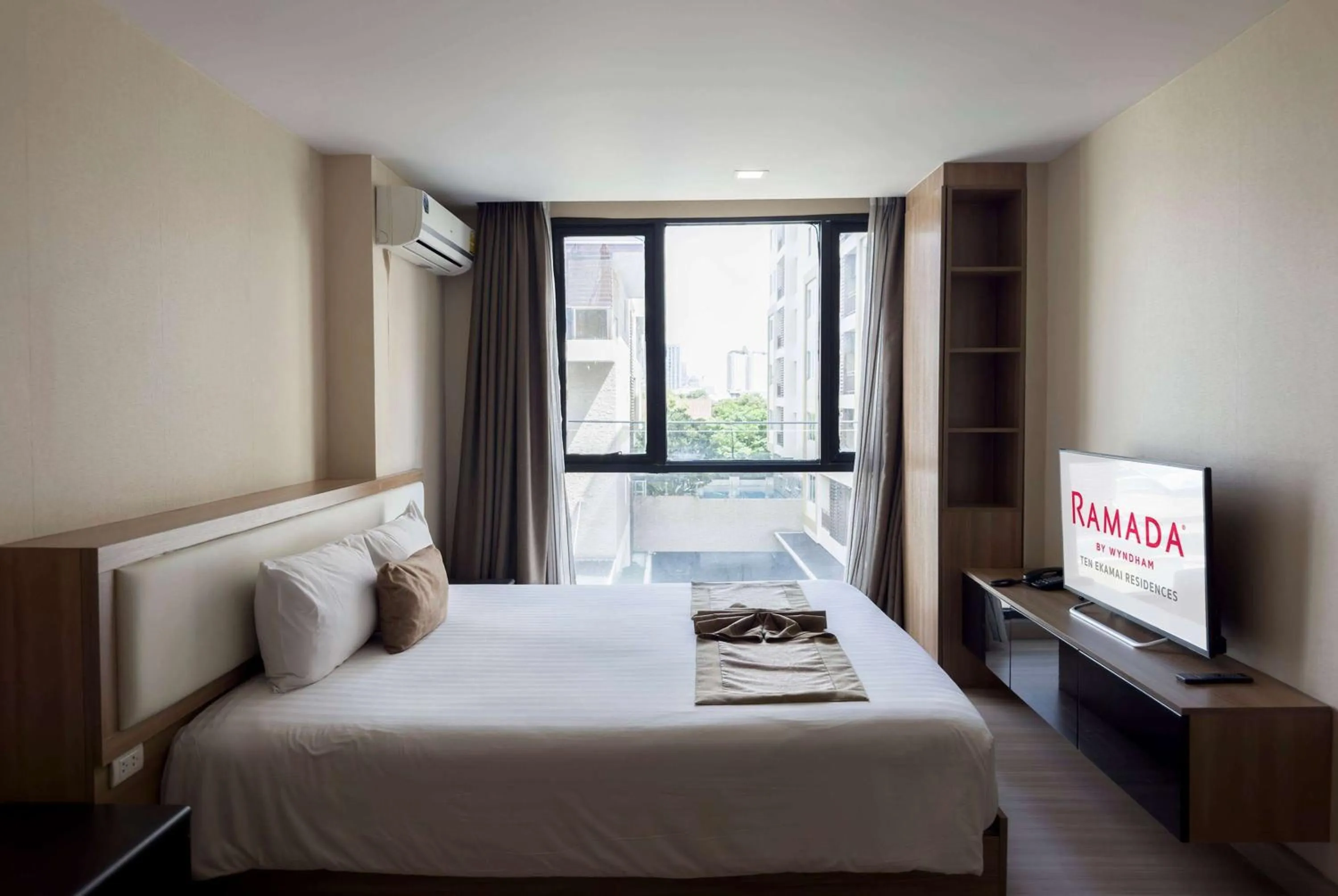 Photo of the whole room, Bed in Ramada by Wyndham Bangkok Ten Ekamai Residences