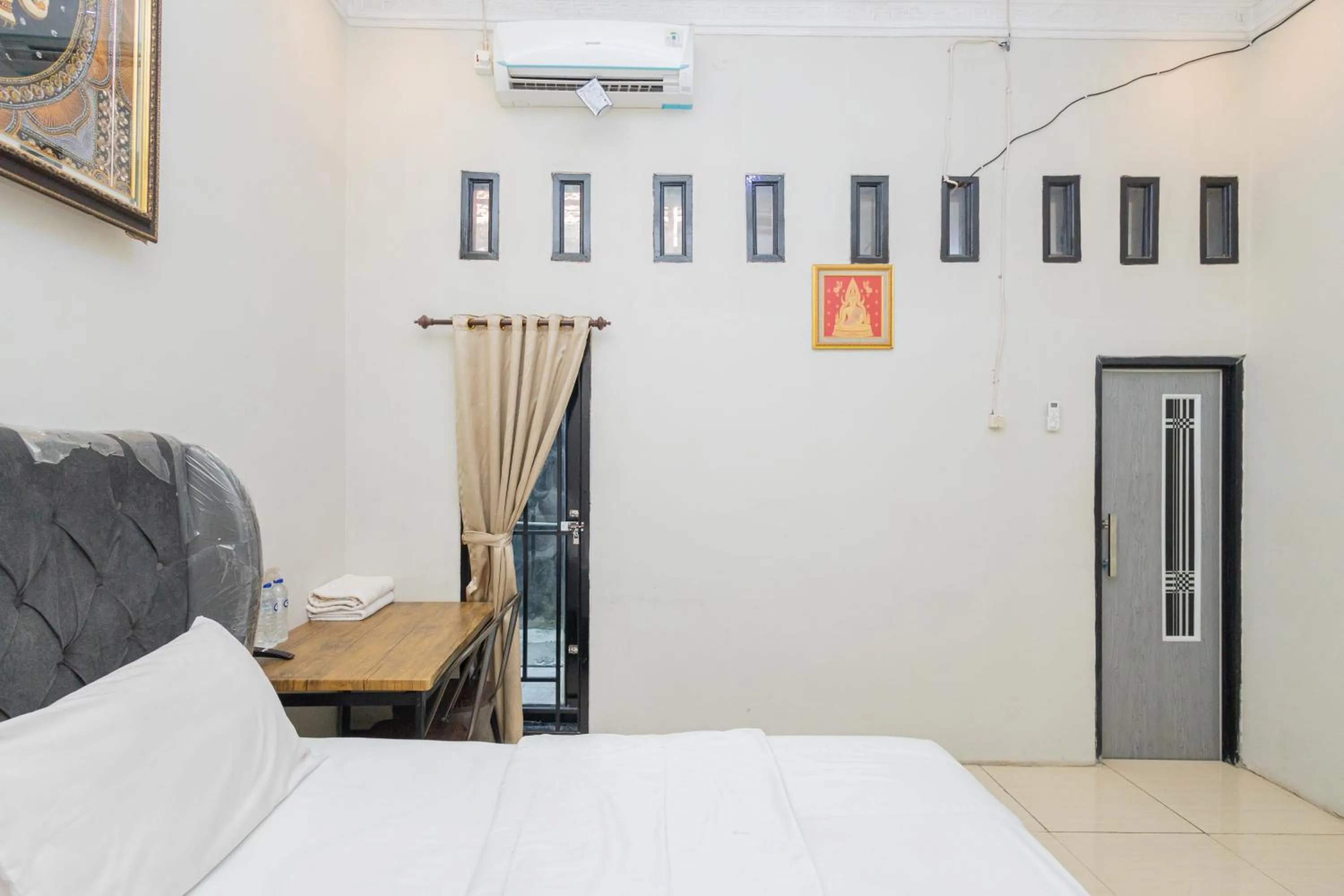 Bed in Boss Residence Serang Mitra RedDoorz