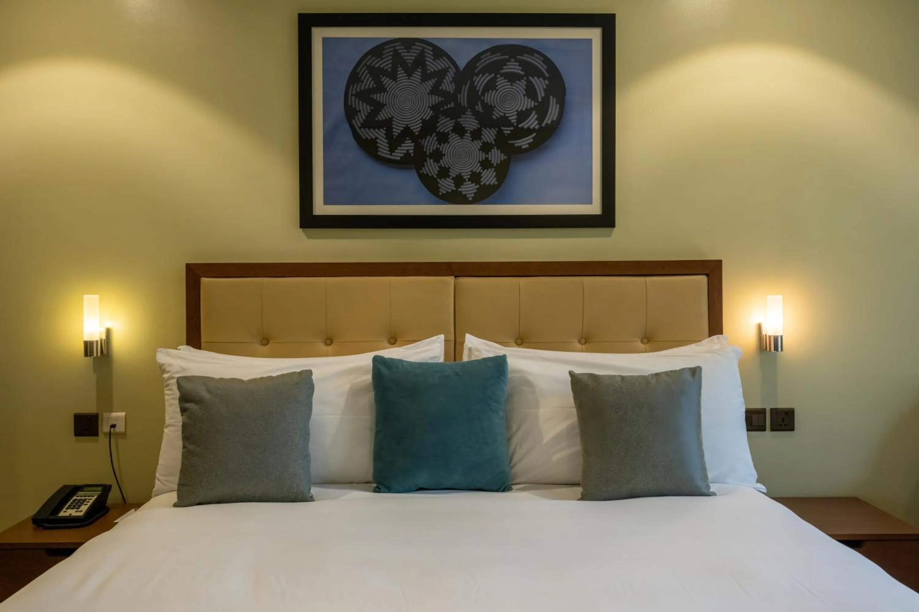 Bed in Mantis Kivu Marina Bay Hotel