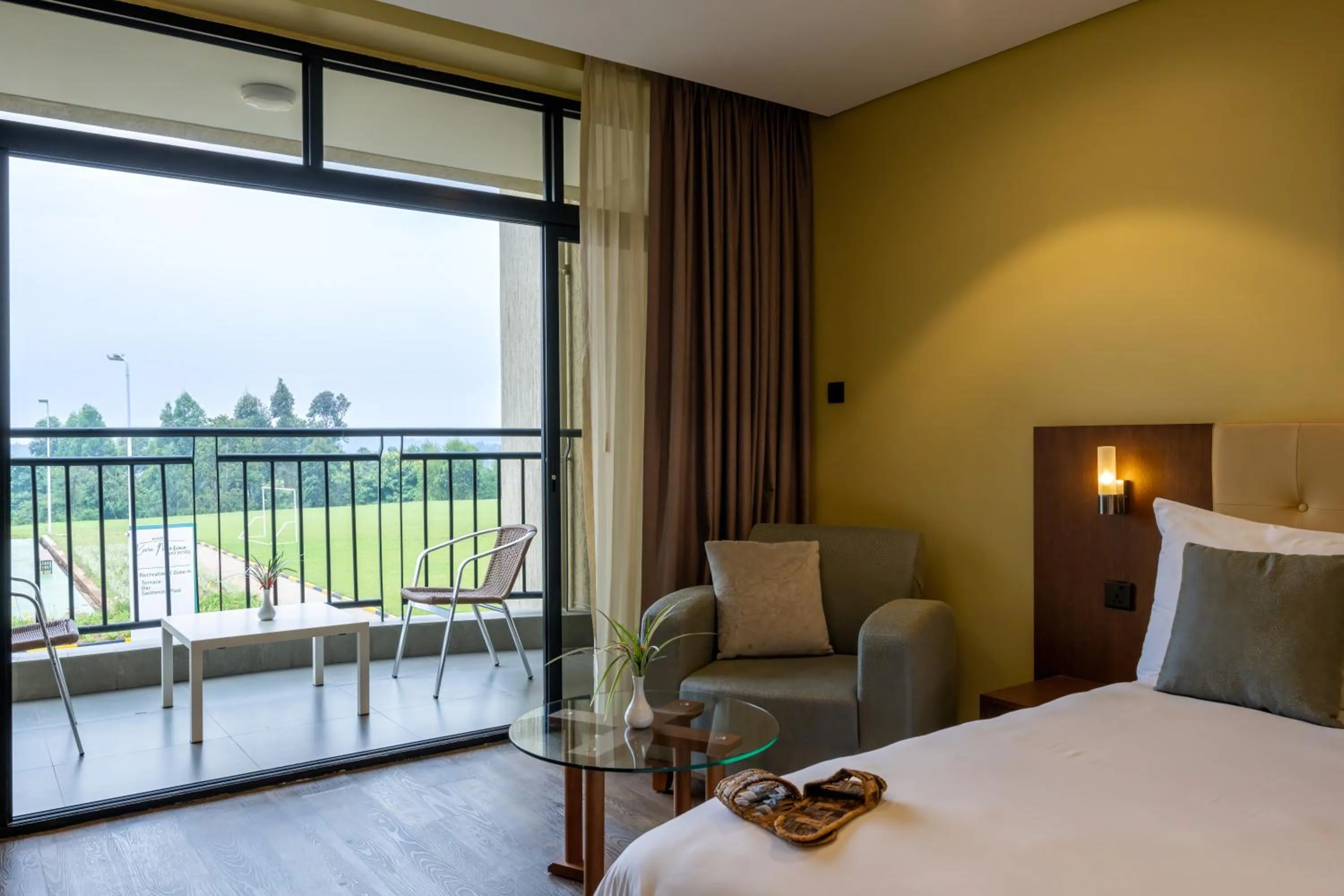 Seating area, Bed in Mantis Kivu Marina Bay Hotel