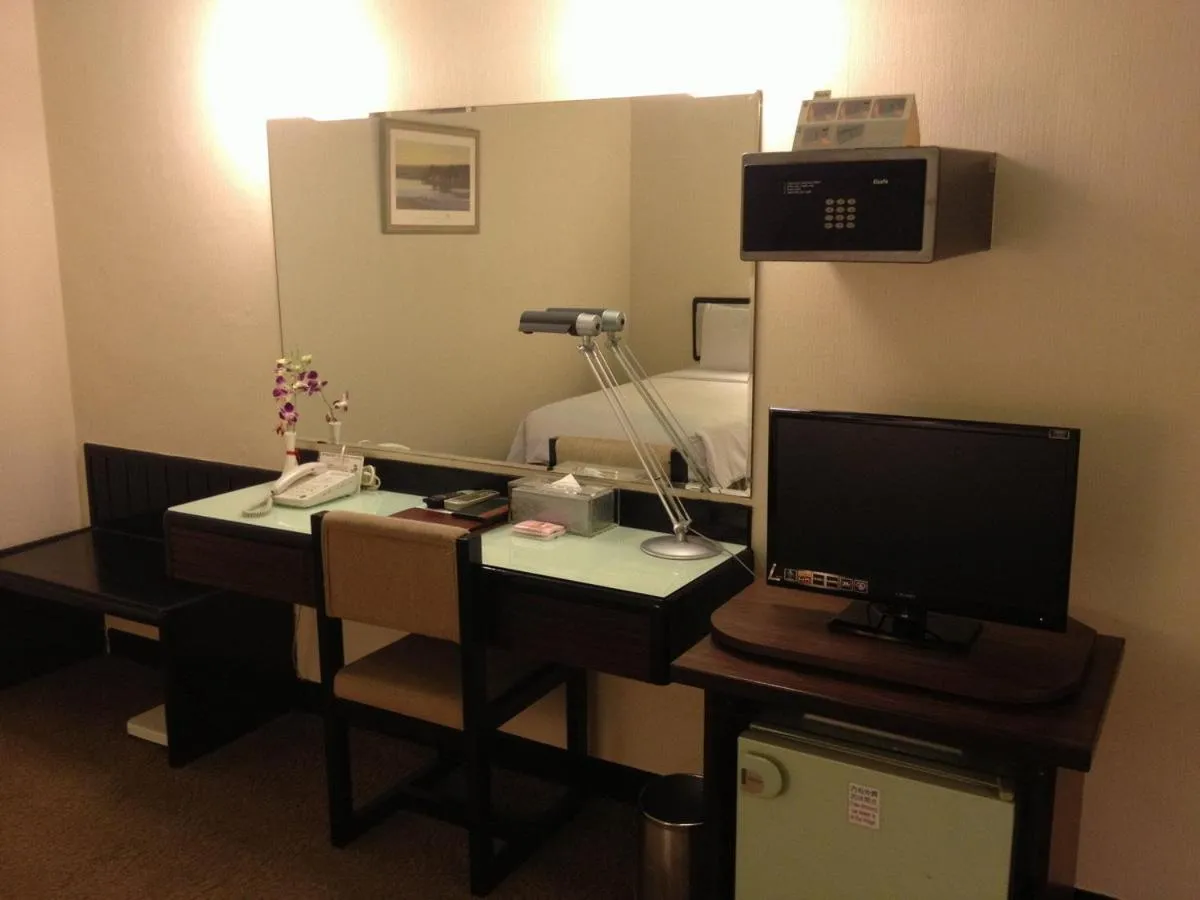 Photo of the whole room, TV/Entertainment Center in The Premier Hotel