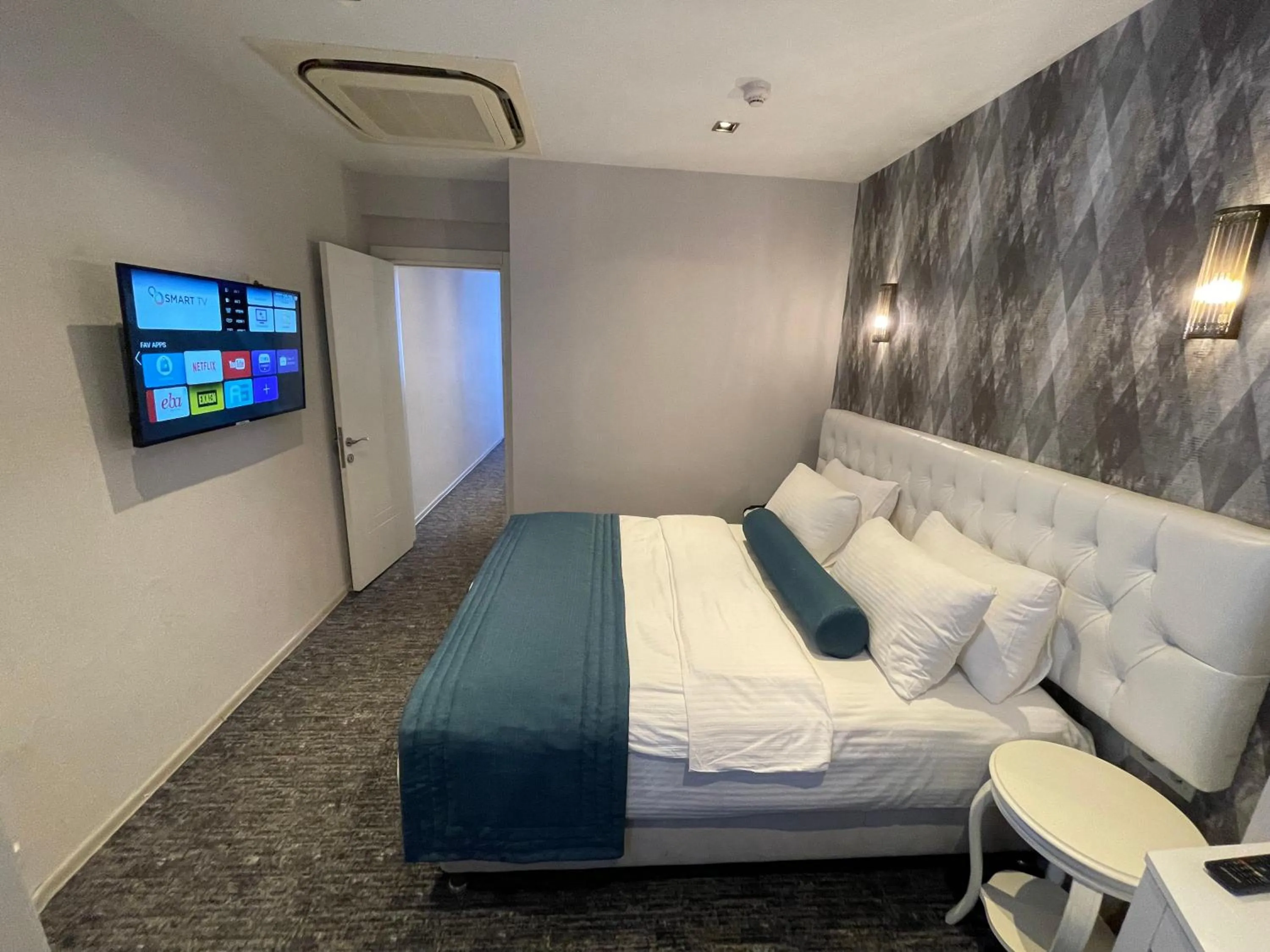 Bed in Mayfair Seaside Hotel