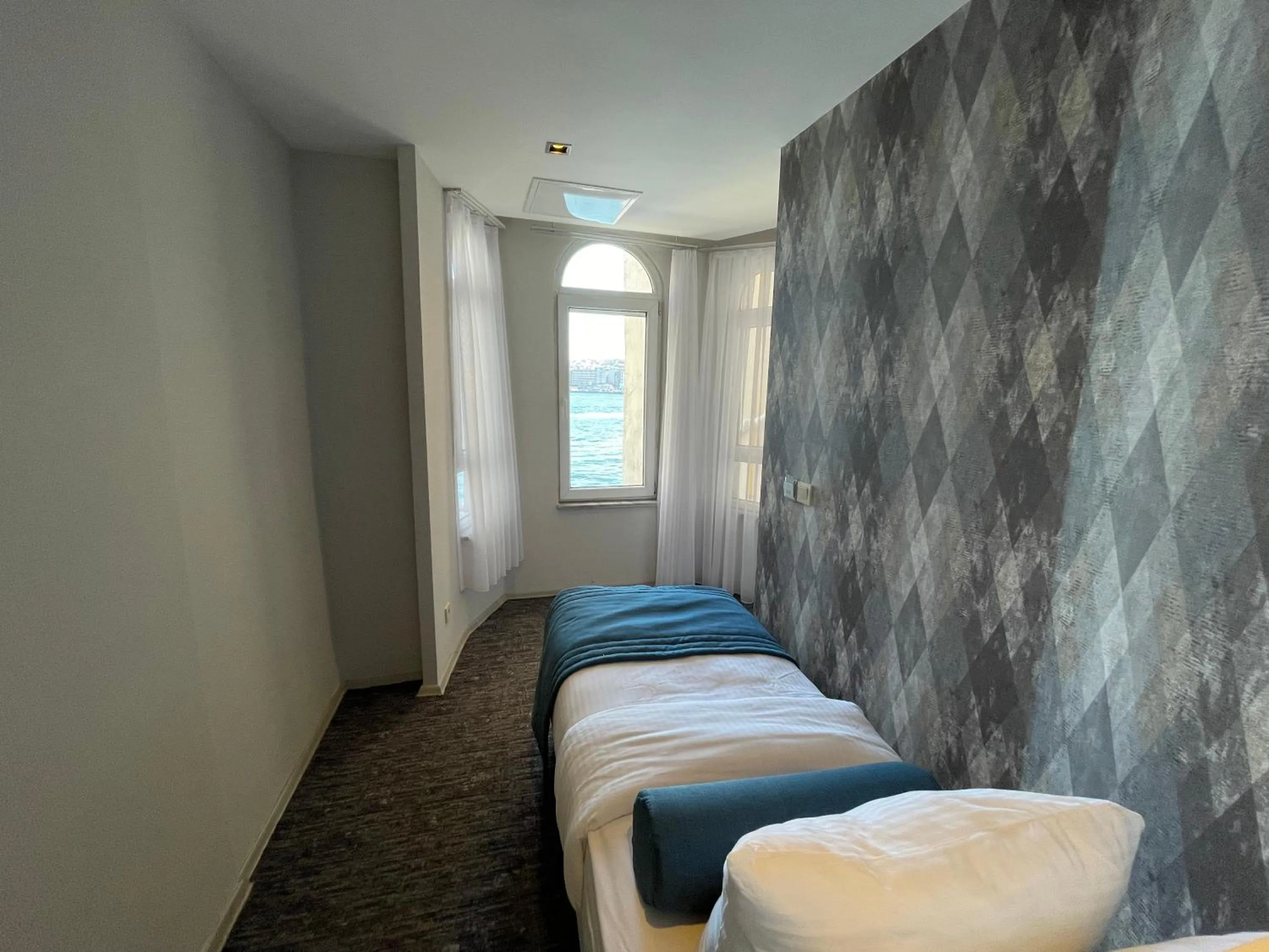 Bed in Mayfair Seaside Hotel