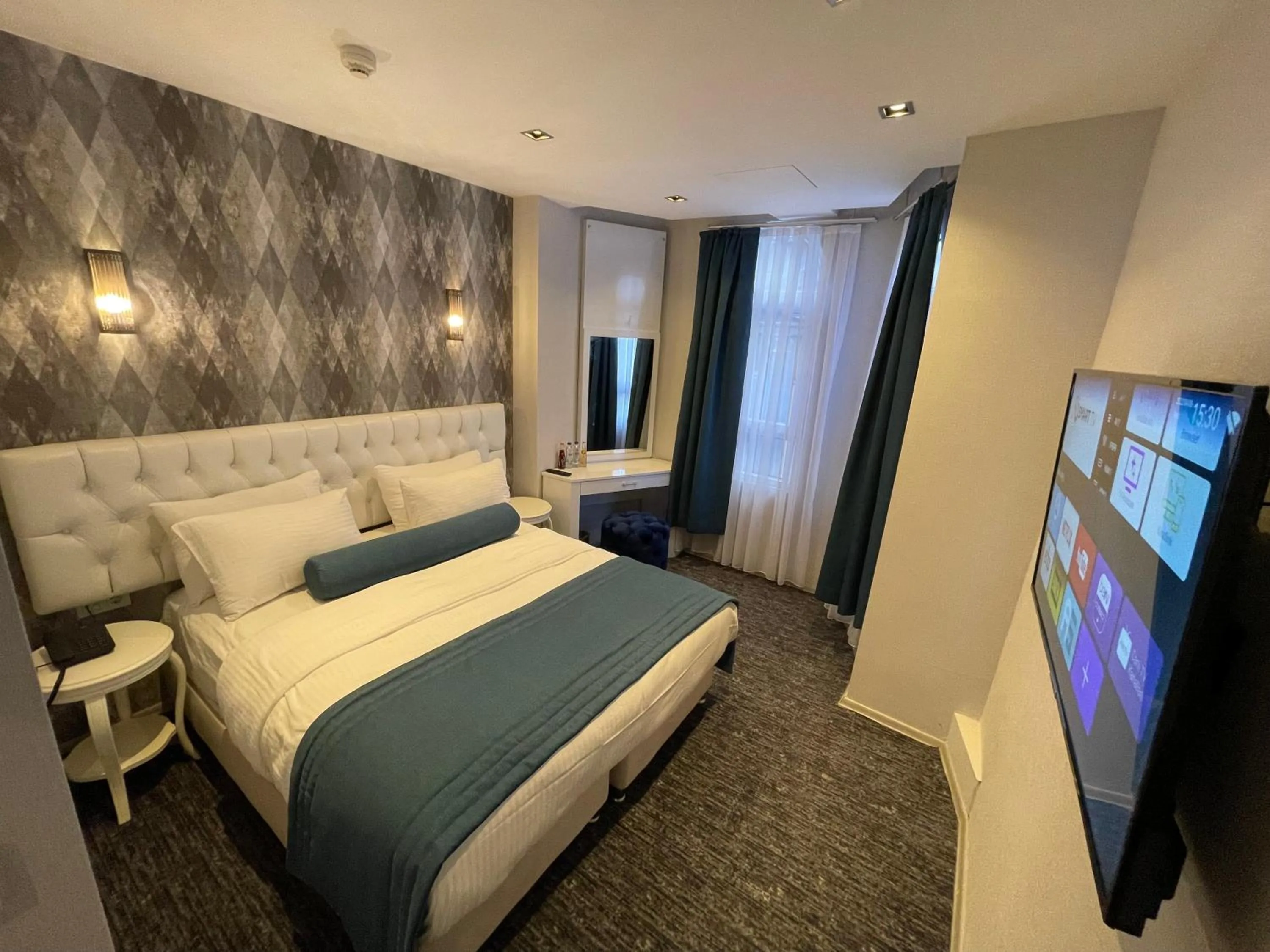 Bed in Mayfair Seaside Hotel