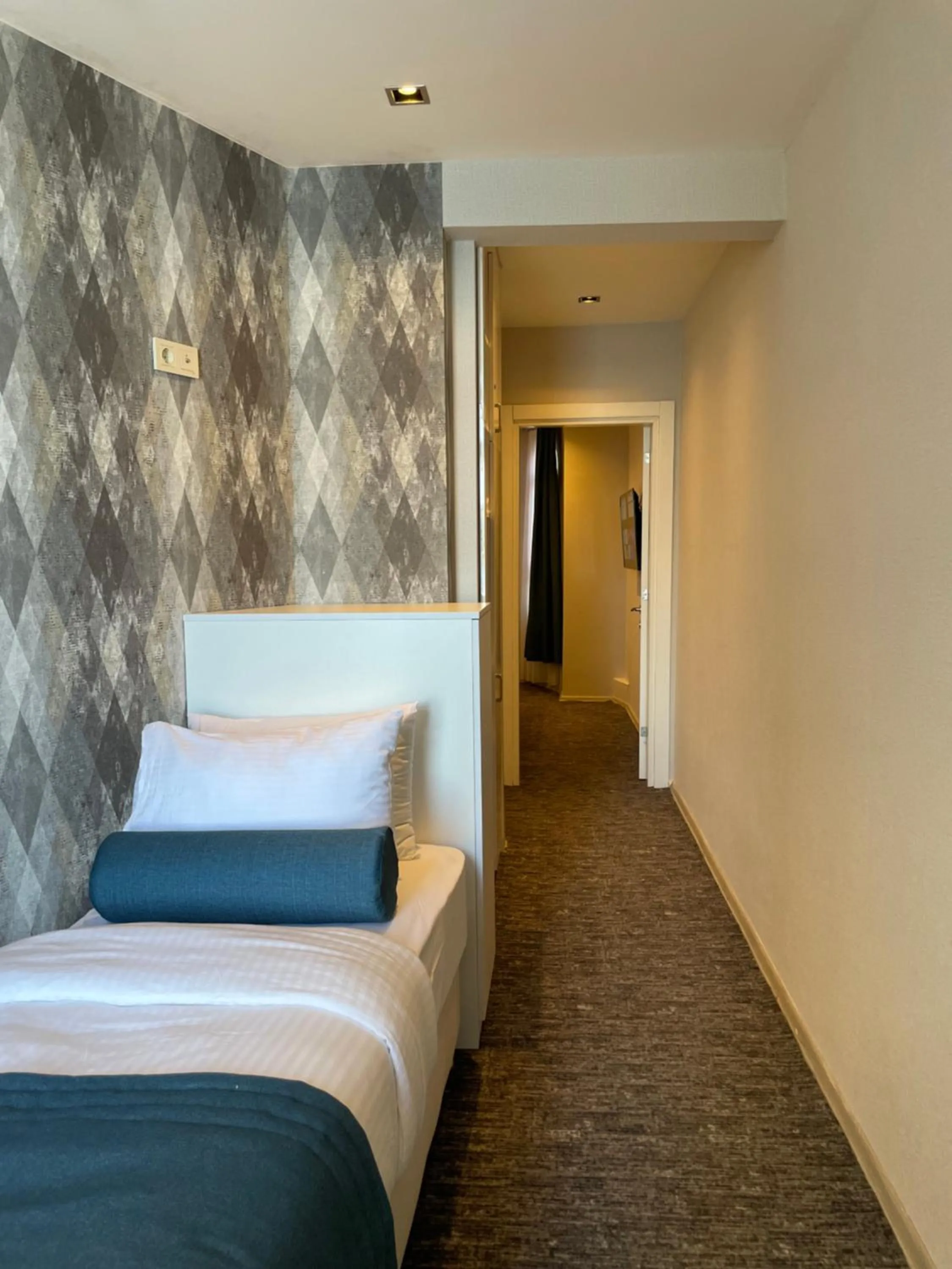 Bed in Mayfair Seaside Hotel