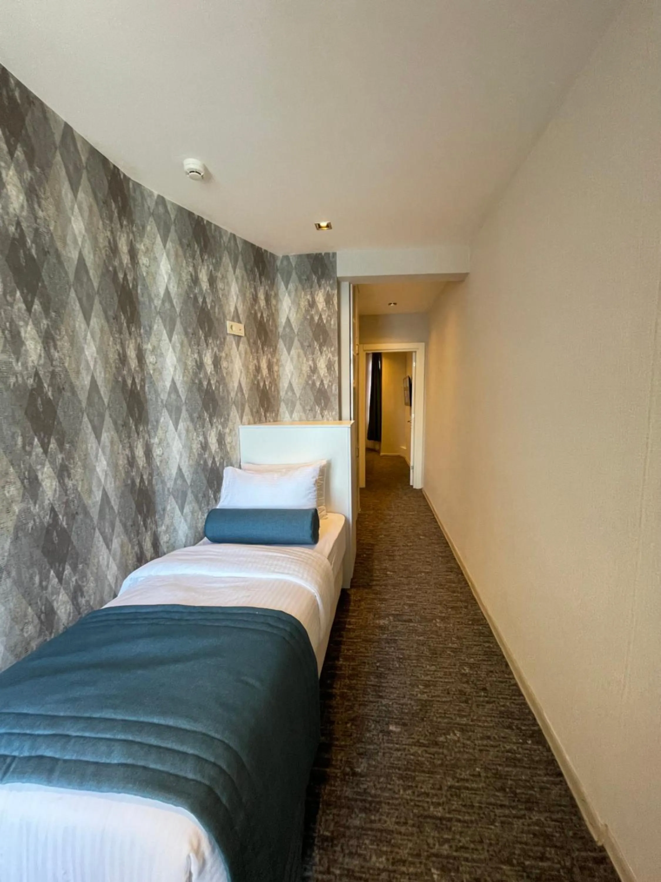 Bed in Mayfair Seaside Hotel