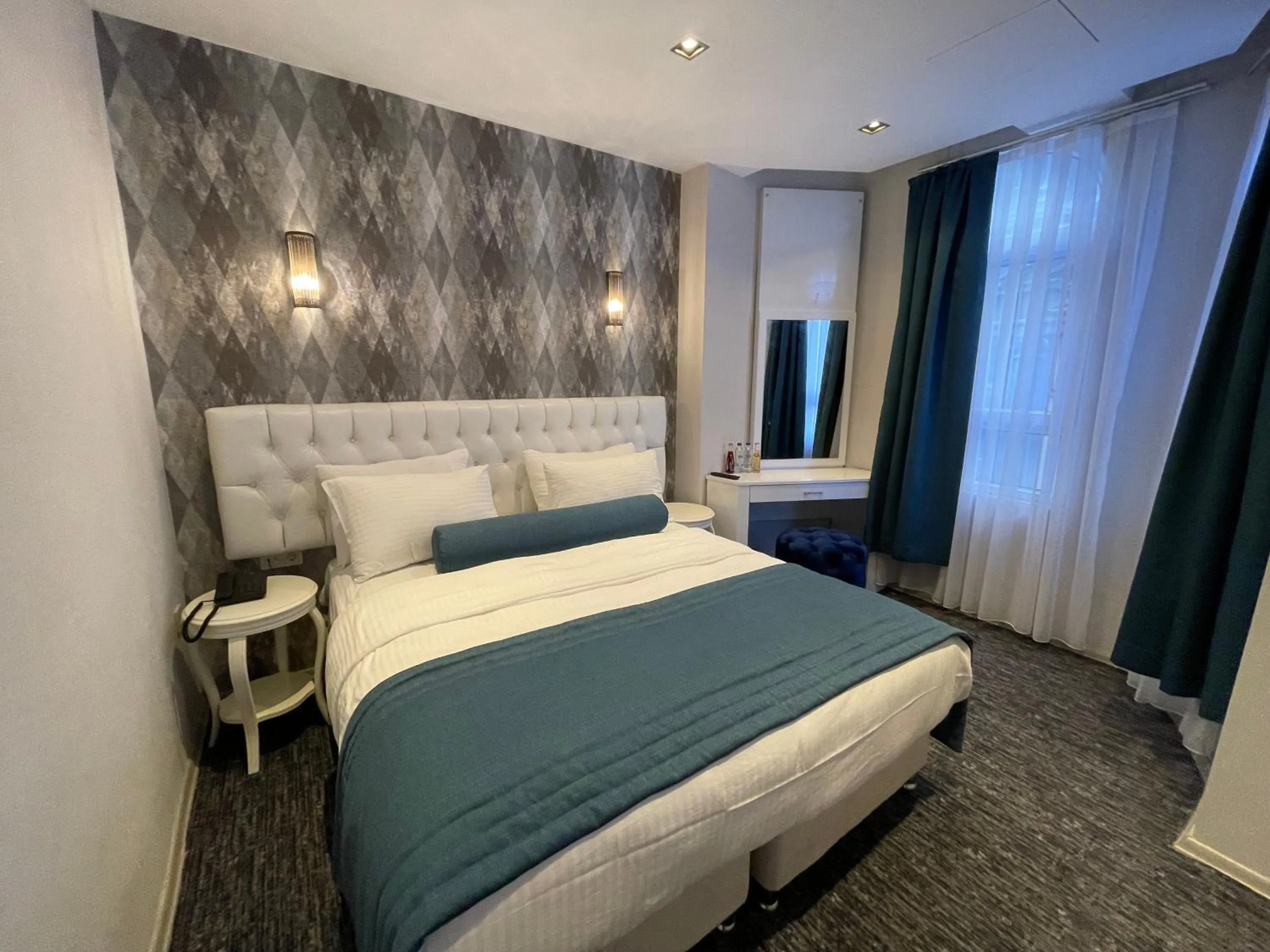 Bed in Mayfair Seaside Hotel